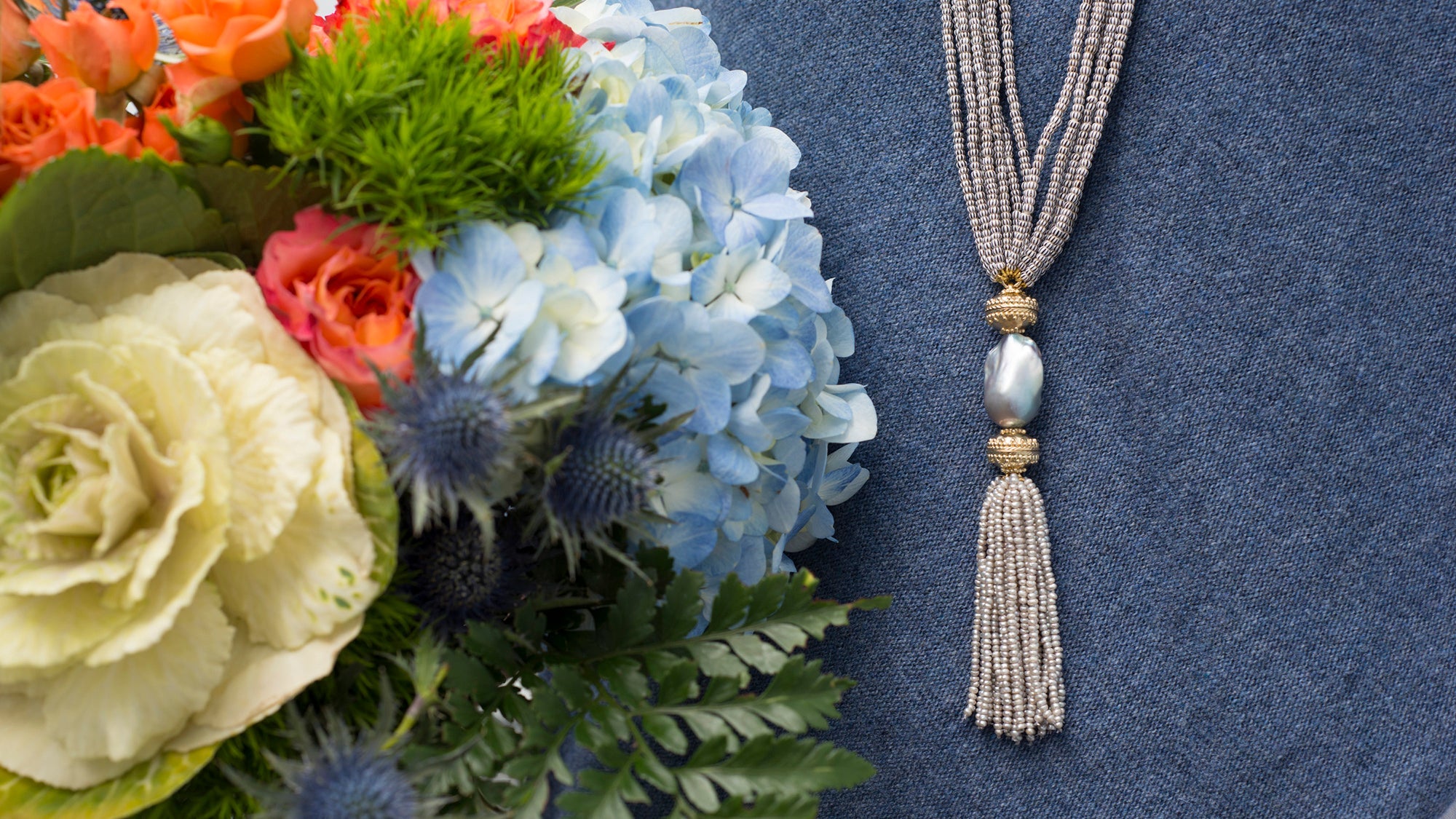 Clara Williams tassel, pearl centerpiece, multi strand necklace