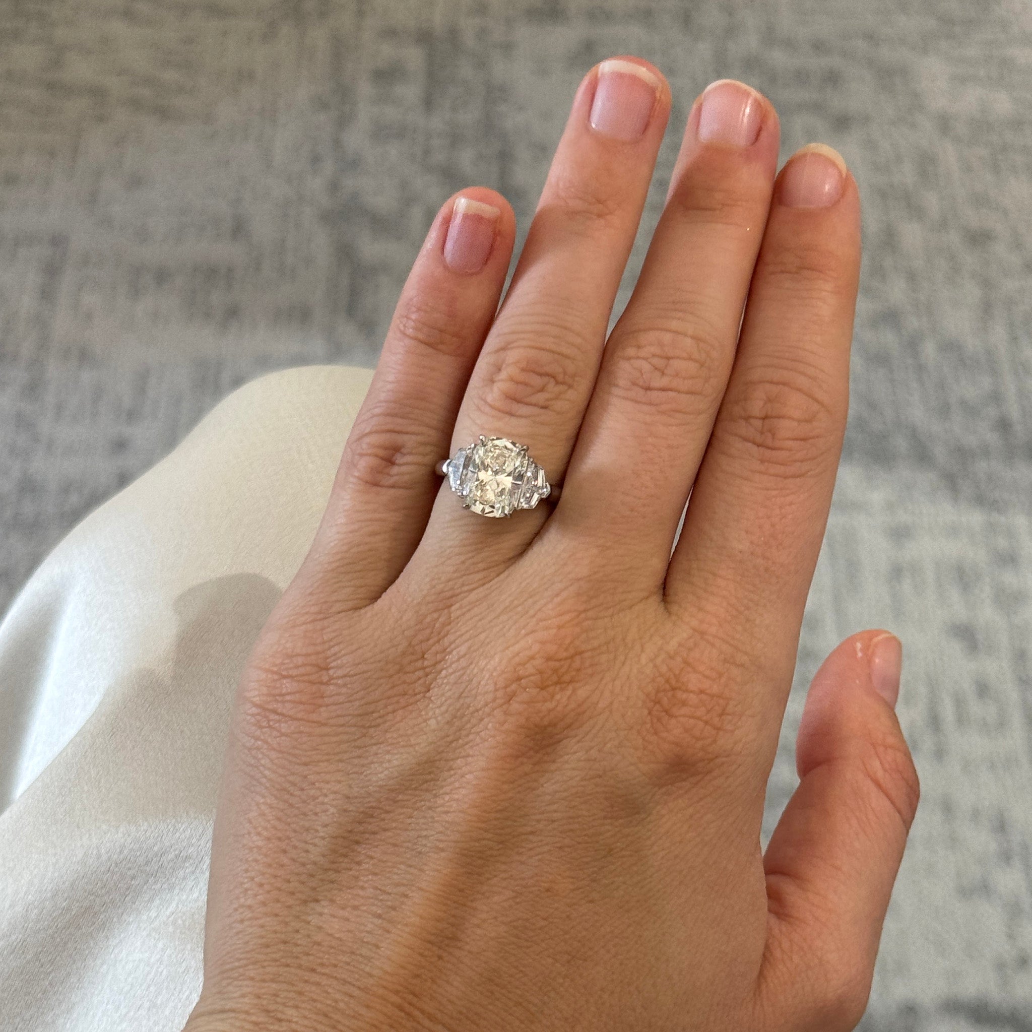 3ct Cushion Center & .81ctw Side Diamond Three-Stone Platinum Ring