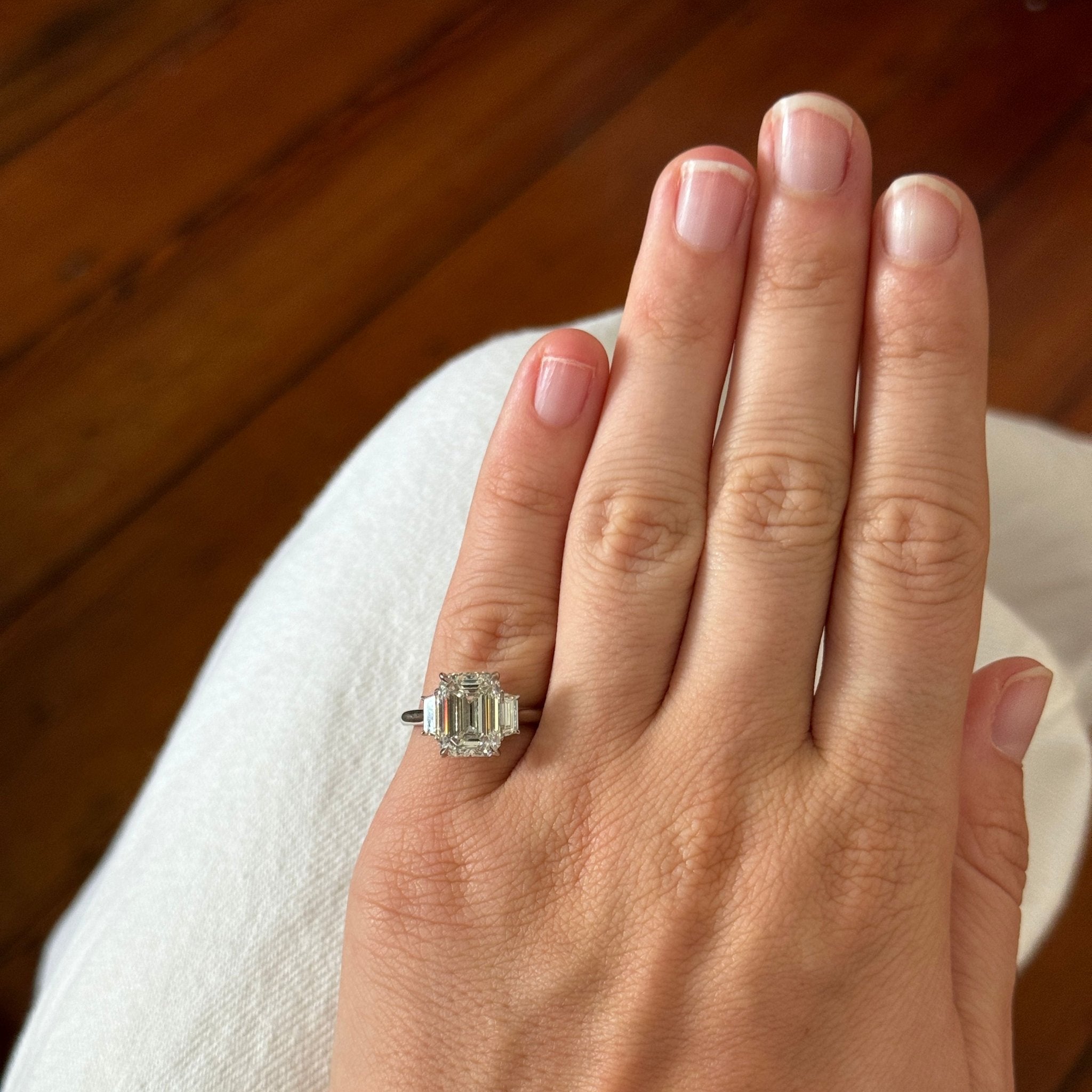 4ct Emerald-Cut & .51ct Trapezoid Side Diamond Three-Stone Platinum Ring