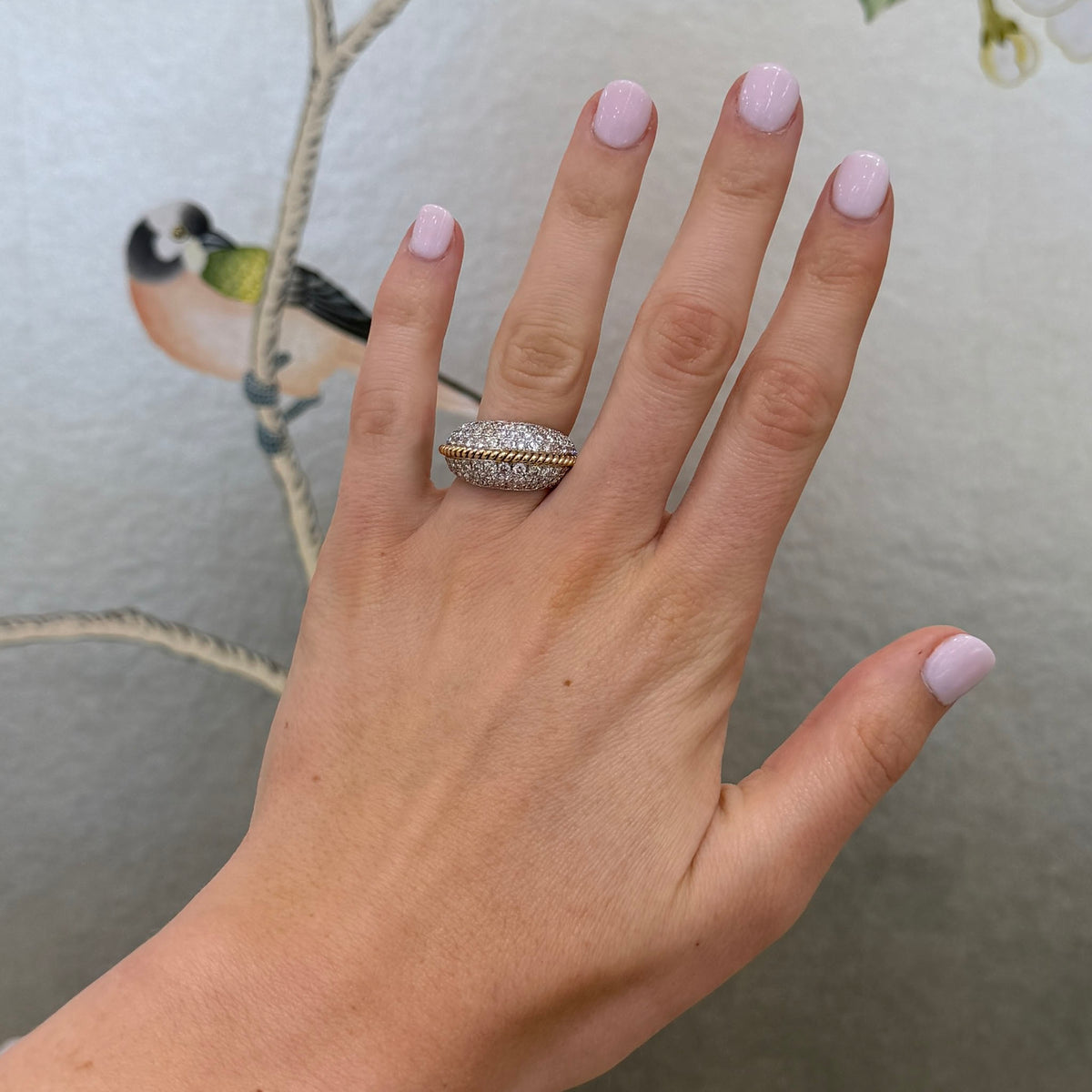 Model with painted nails wearing 2.23ctw Diamond Pavé 14K Gold Rope Twist Dome Ring on their ring finger.