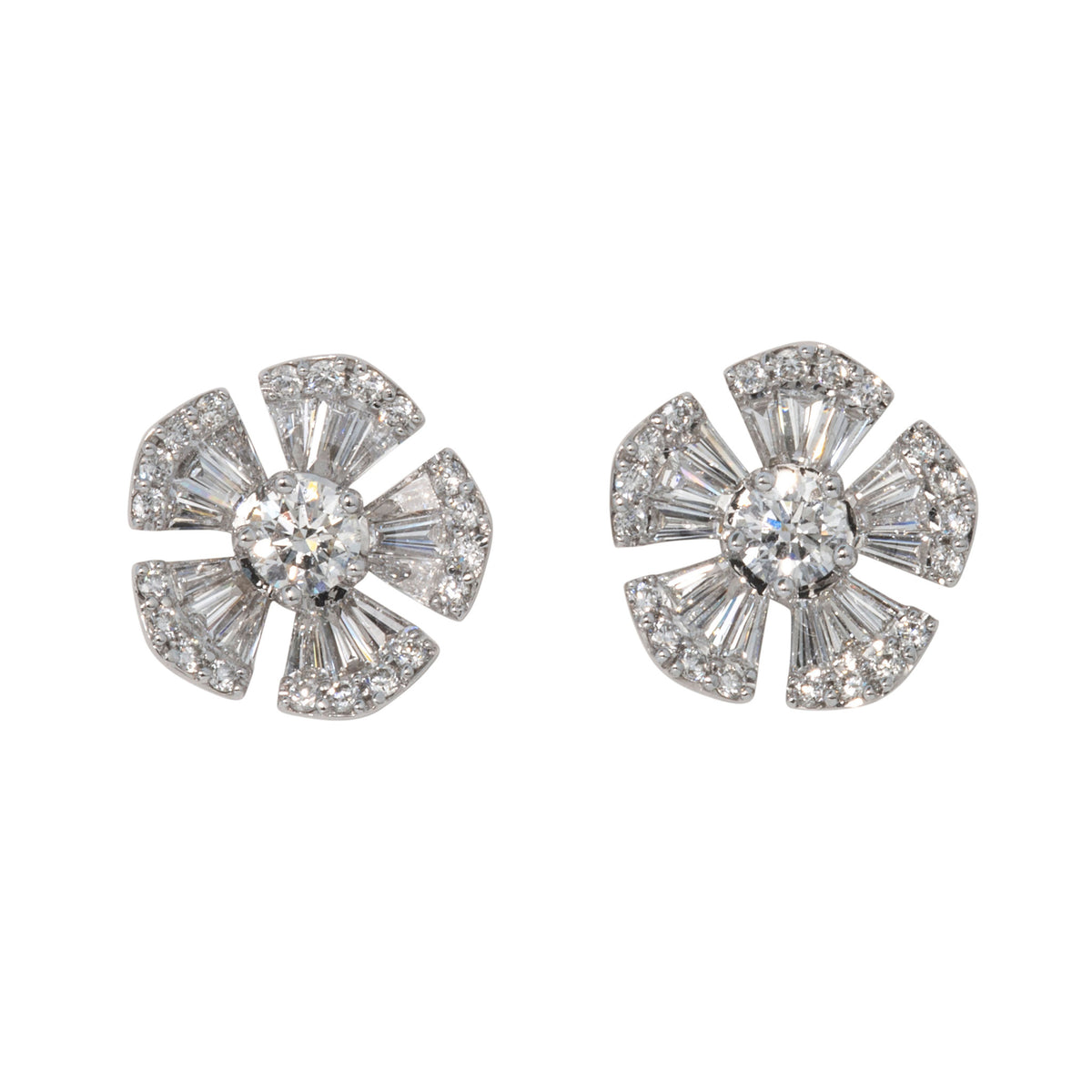 Pair of 14K white gold flower stud earrings with round diamond centers and five petals set with baguette and round diamonds.