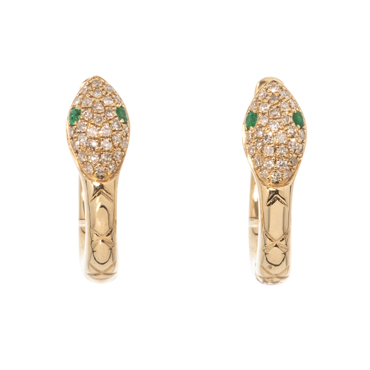 Pair of 14K yellow gold snake huggie earrings with pavé diamond heads, emerald eyes, and engraved scale details.