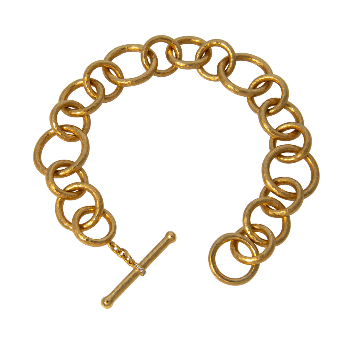 14K yellow gold bracelet with hammered round links in mixed sizes and an open diamond-accented toggle clasp.