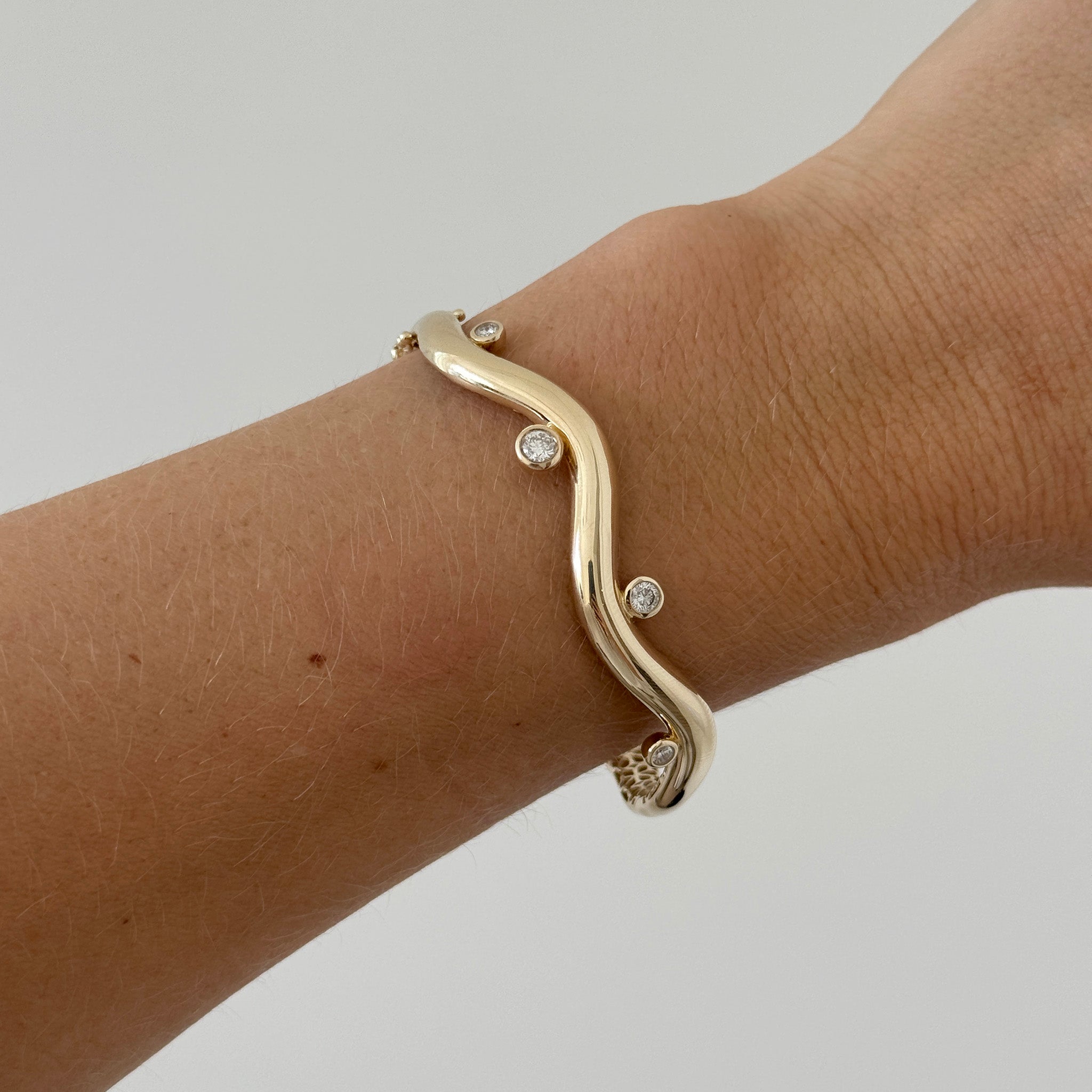 .57ctw Diamond Bezel 14K Yellow Gold Wavy Bangle