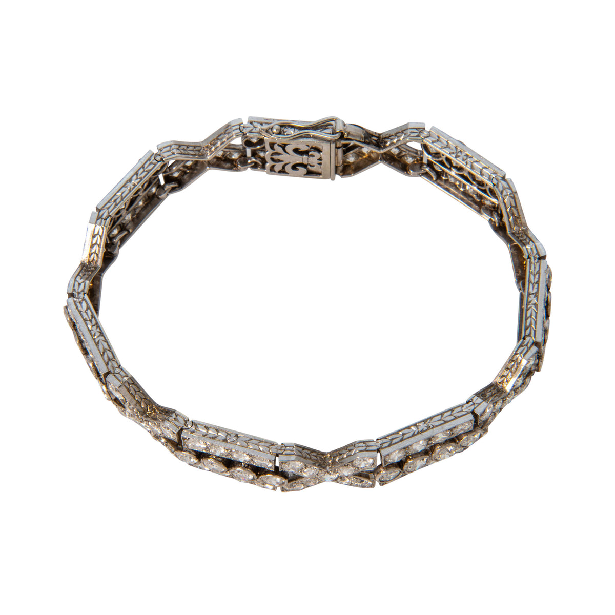 Side view of the French Art Deco-style diamond platinum bracelet, showing engraved link edges and the decorative clasp.⠋