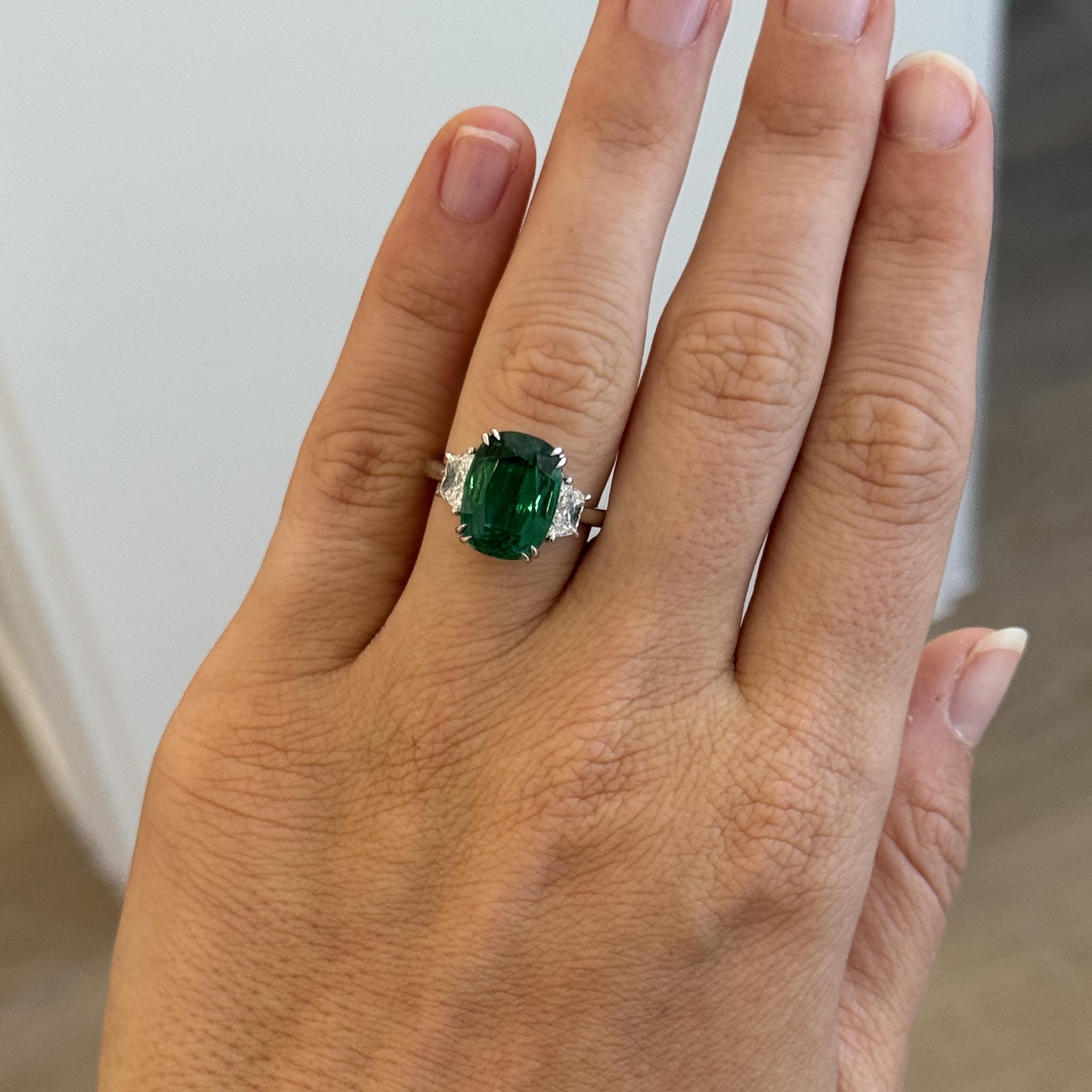 5ct Cushion Emerald & Trapezoid Diamond Three-Stone Platinum Ring