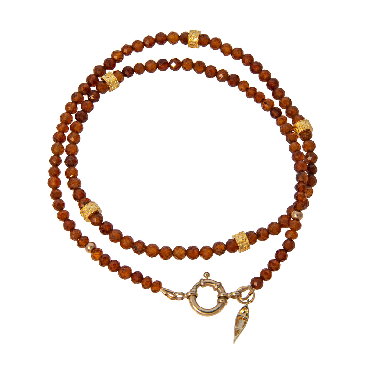 Tippy Stern faceted hessonite garnet beaded necklace with five ornate yellow gold rondelles and a canoe charm.