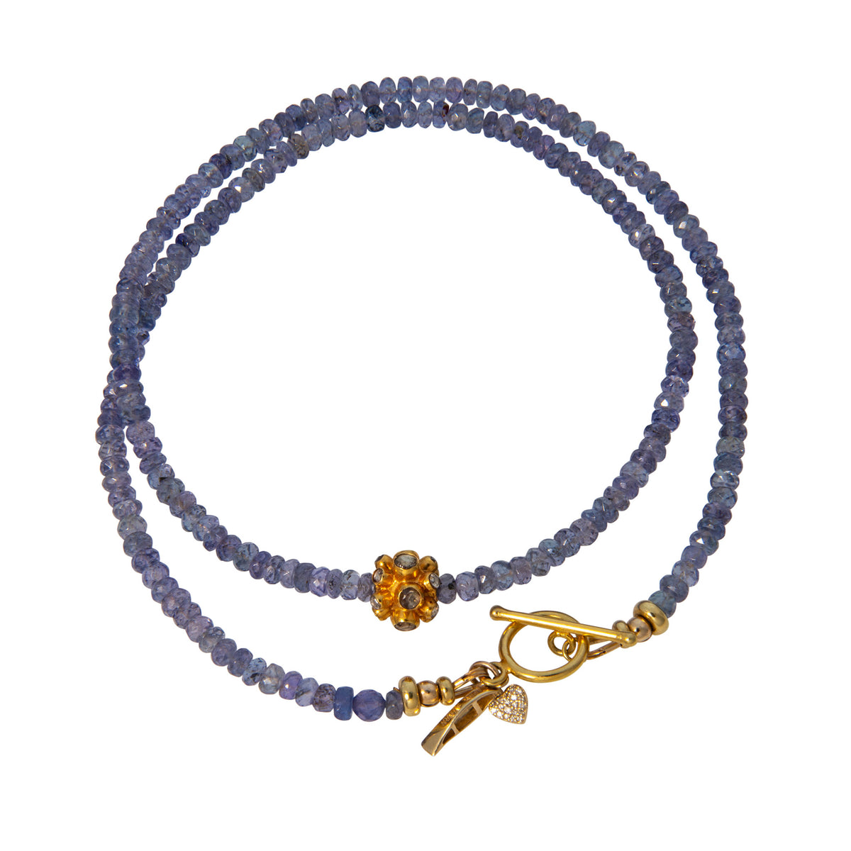 Tippy Stern faceted tanzanite beaded necklace with a stone-set yellow gold rondelle, toggle clasp, diamond pavé heart charm, and canoe charm.