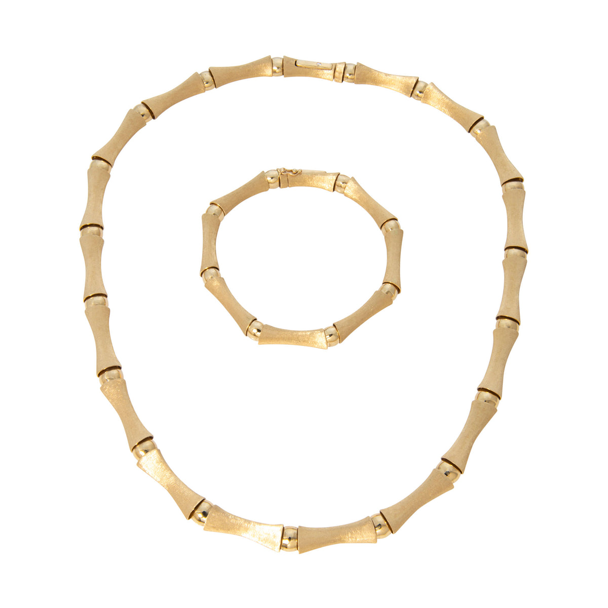 14K yellow gold bamboo link necklace displayed with a matching bracelet, showing satin-finish links and polished connectors.