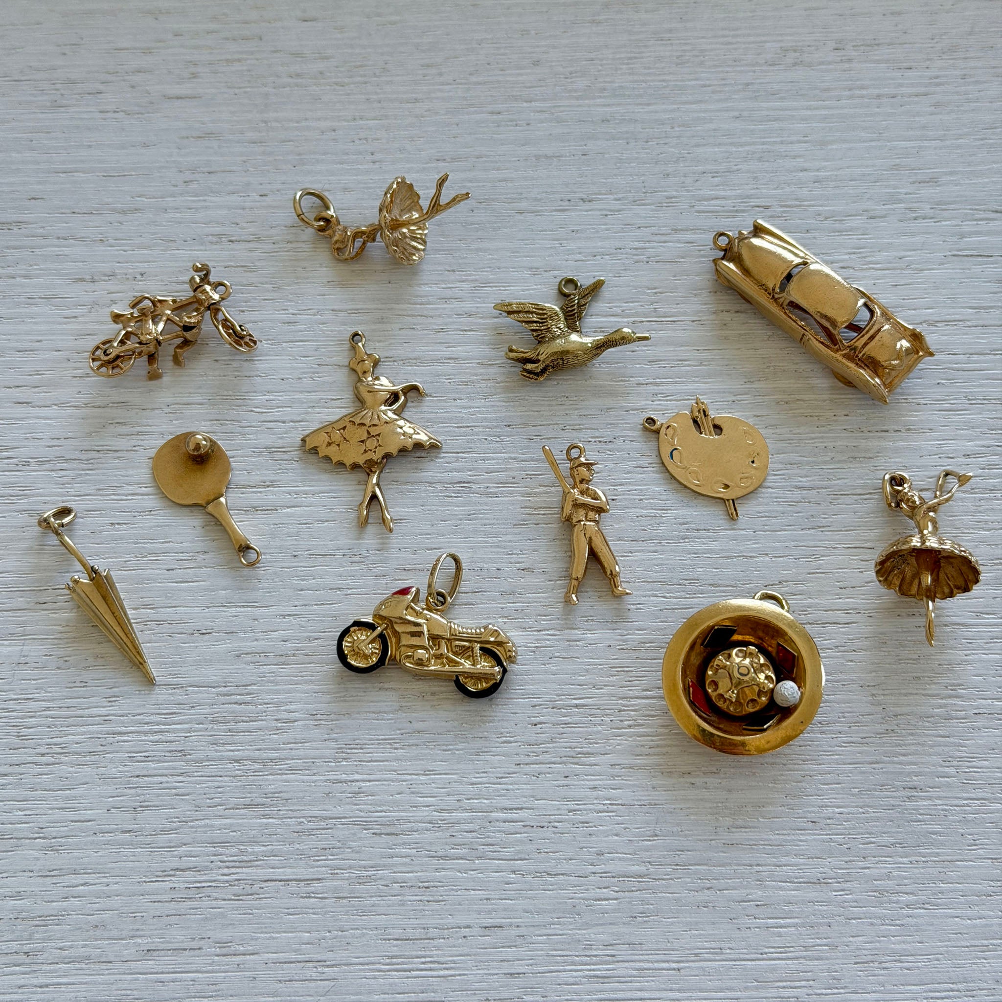 Vintage 14K Gold Umbrella Charm, Vintage 18K Gold Car Charm, Vintage 14K Gold Artist Paint Palette Charm, Vintage 14K Gold Motorcycle Charm, Vintage 14K Gold Tandem Bike Charm, Vintage 14K Gold Flying Duck Charm, Vintage 14K Gold Baseball Batter Charm, Vintage 14K Gold Ballerina Charms, Vintage Enamel Roulette Wheel 14K Gold Charm
