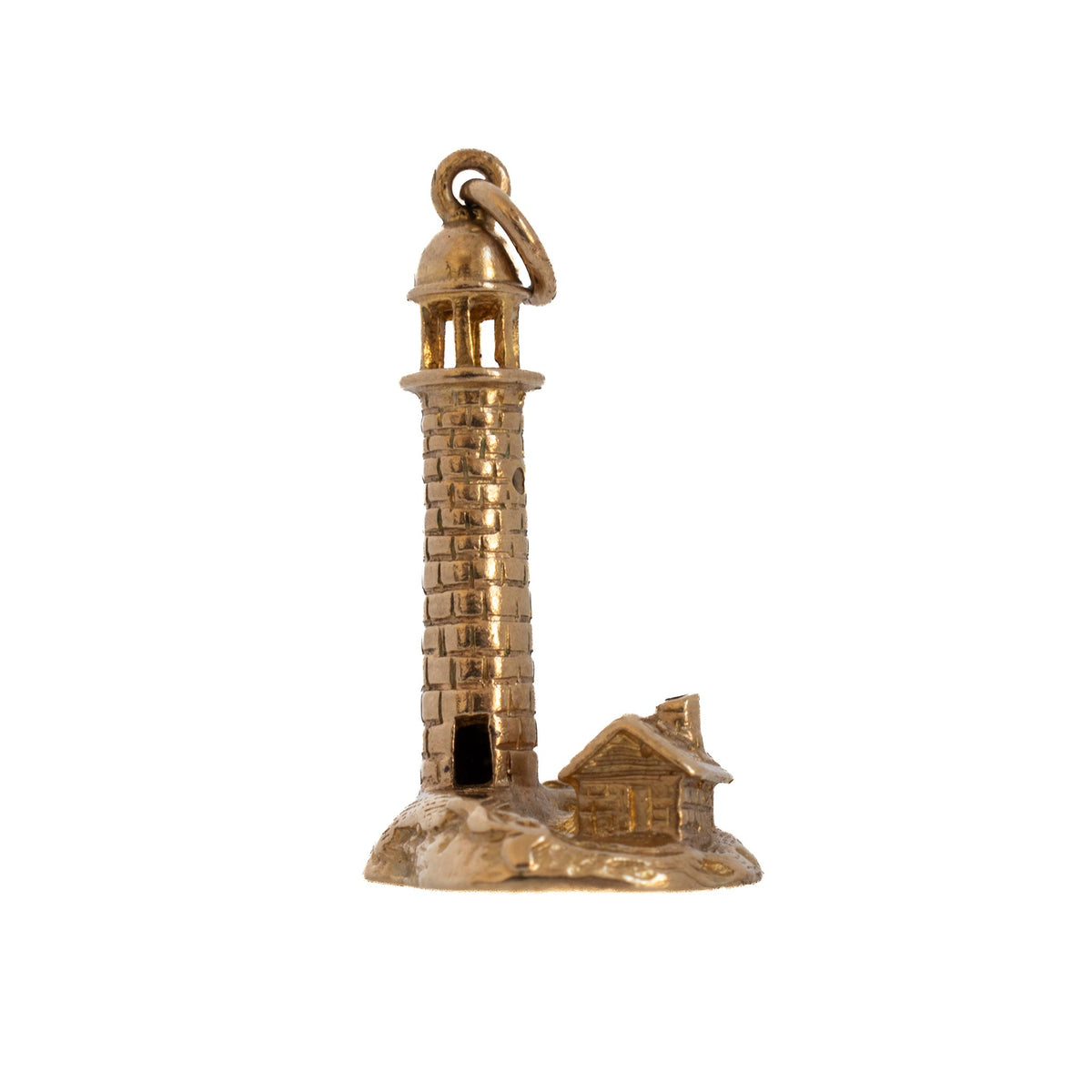 Vintage 9K yellow gold lighthouse charm with brick detailing and a keeper’s house on a rocky base, shown from the front.