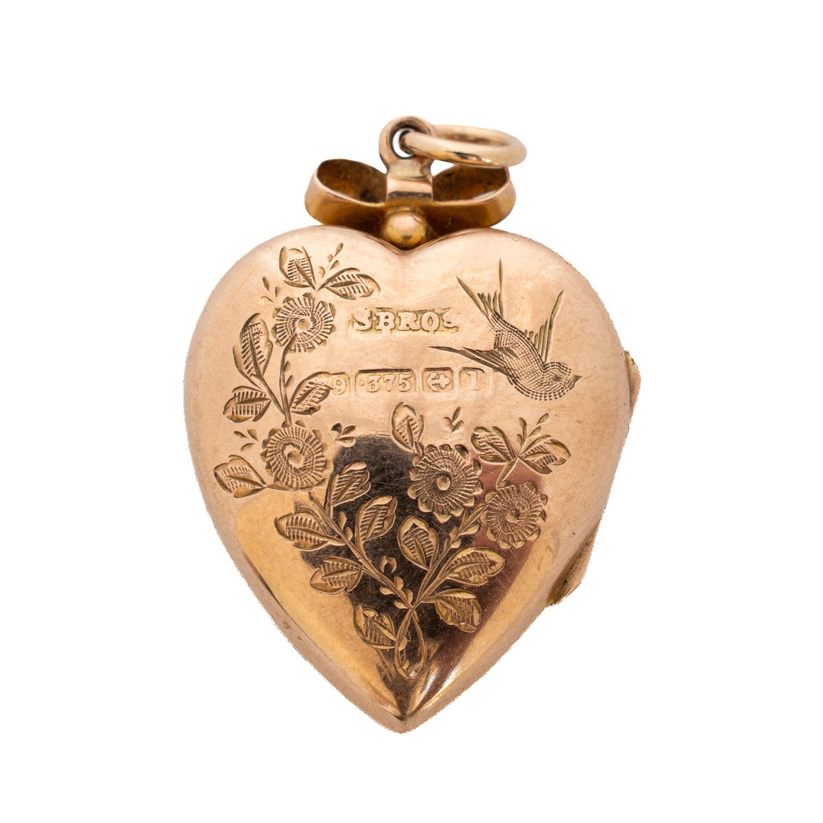 Back view of Edwardian heart locket showing engraved flowers, a flying bird, and stamped markings on the 9K gold back.