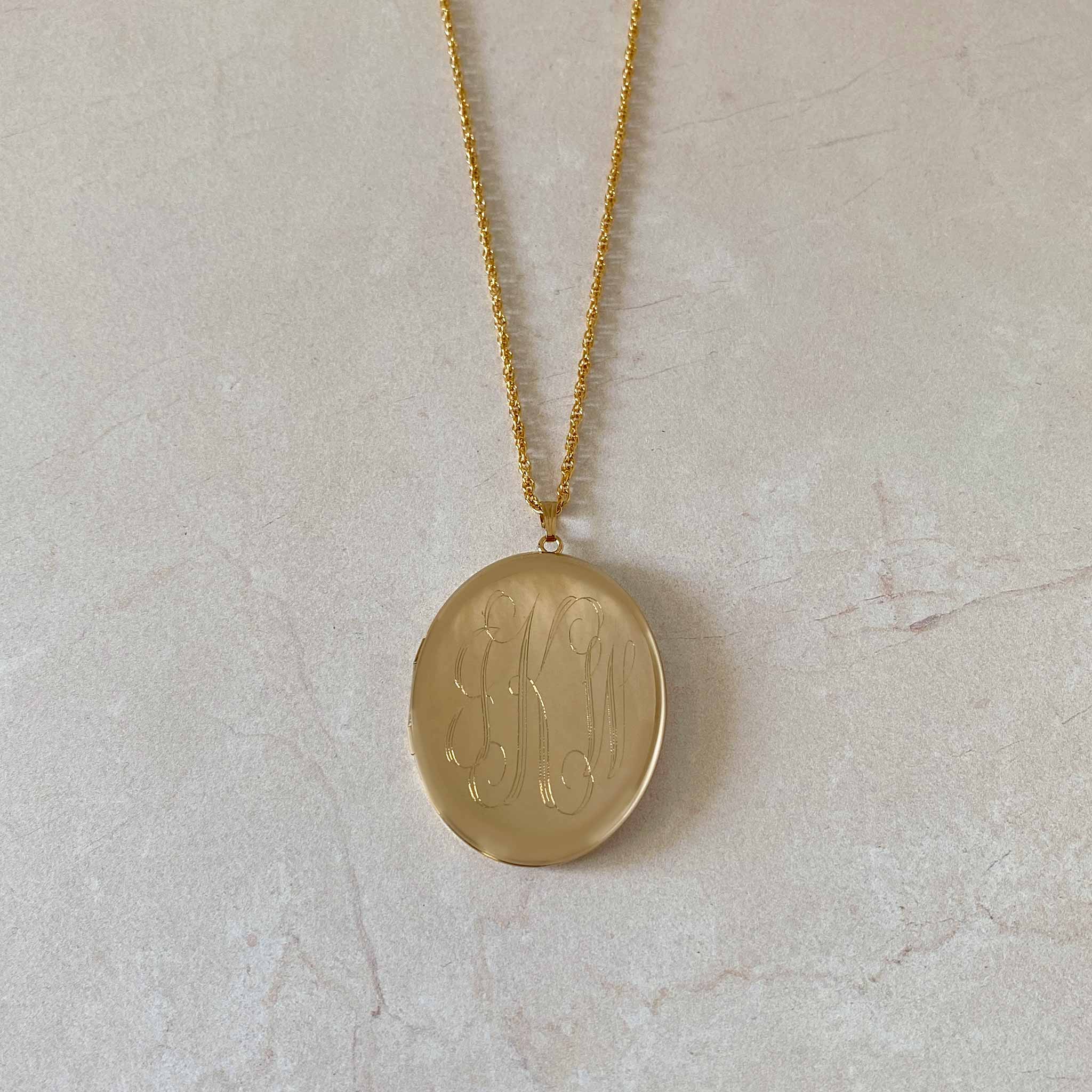 14K Gold-Filled 39x47mm Oval Locket Necklace with machine engraved interlocking script monogram