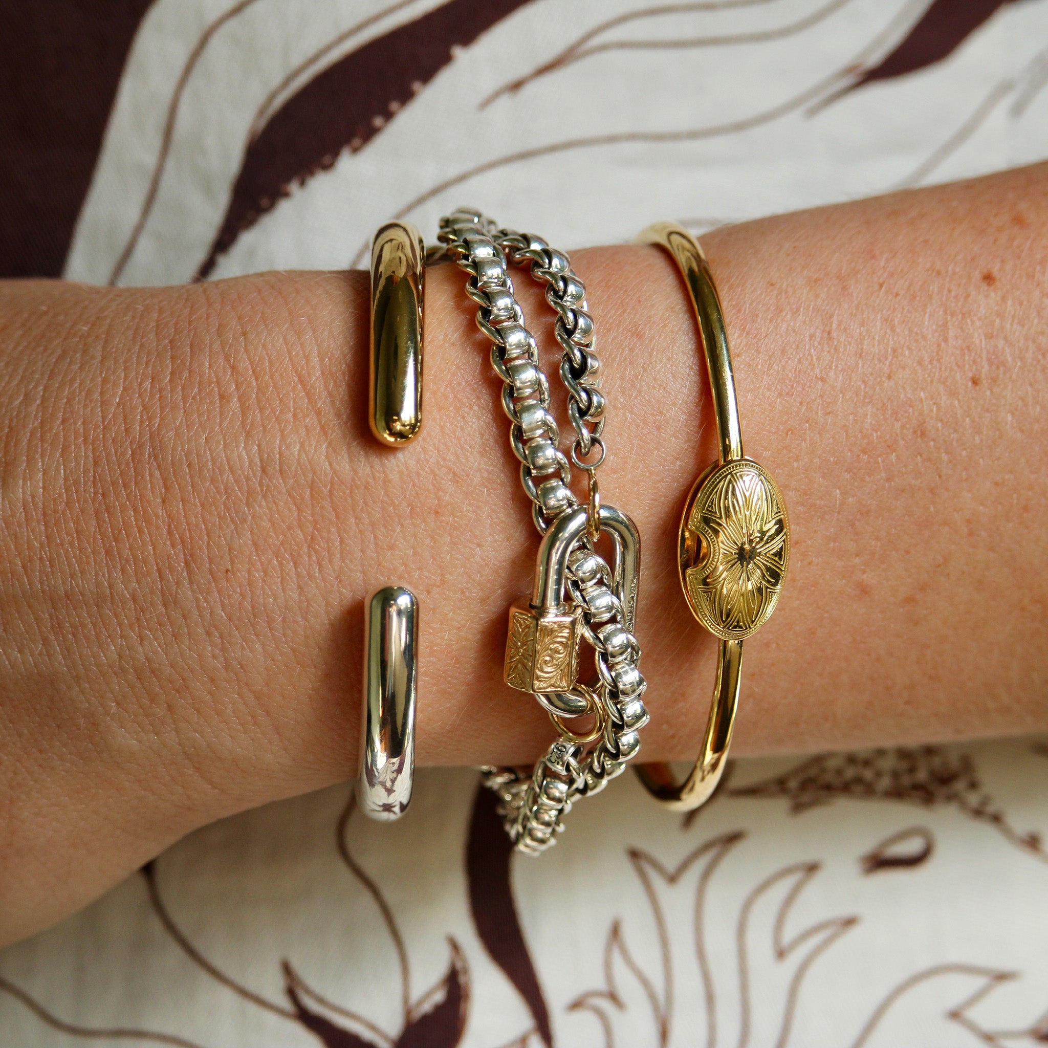 Marla Aaron Silver & 14K Gold Embossed Chubby Medium Lock, Silver & Brass Hinged Cuffling Bangle, 18K Yellow Gold Oval Musgrave Bracelet