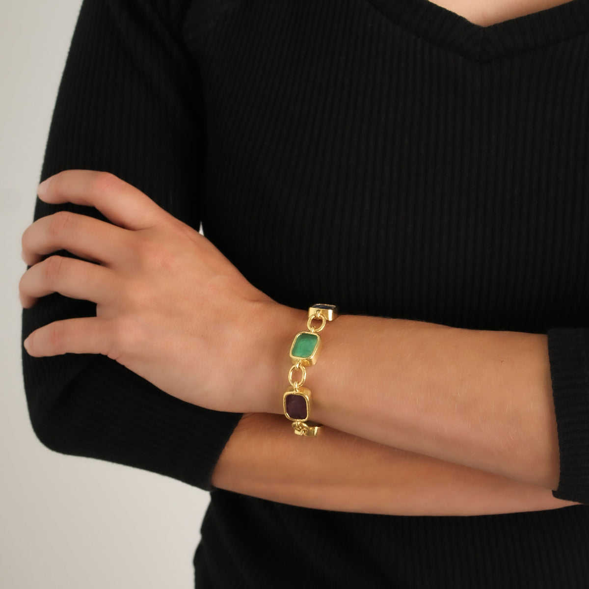 Elizabeth Locke Antique Animals Venetian glass intaglio bracelet in 19K yellow gold shown on the wrist.
