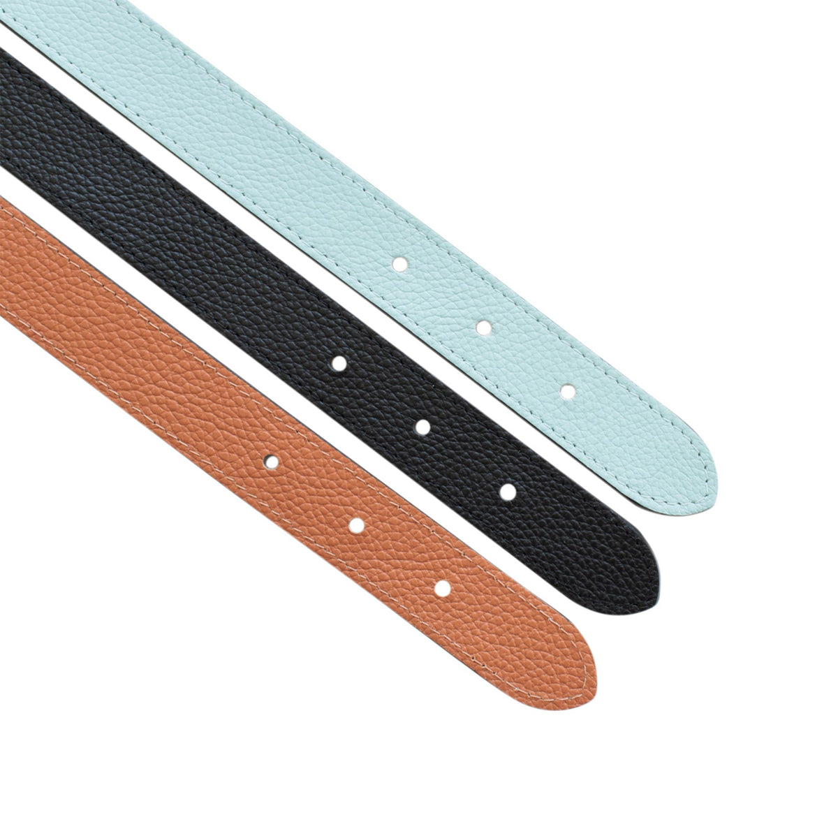 Three regular leather belt straps in saddle brown, black, and light blue, arranged diagonally on a white background.