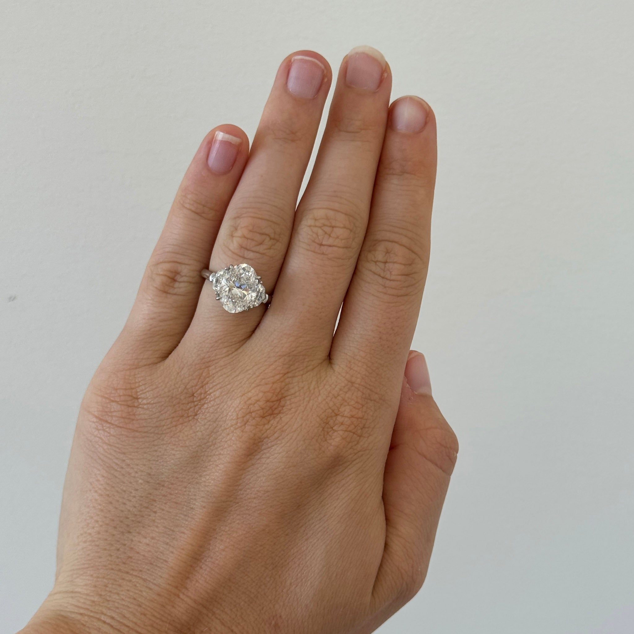 4ct Oval Center & .54ctw Epaulette Side Diamond Three-Stone Platinum Ring