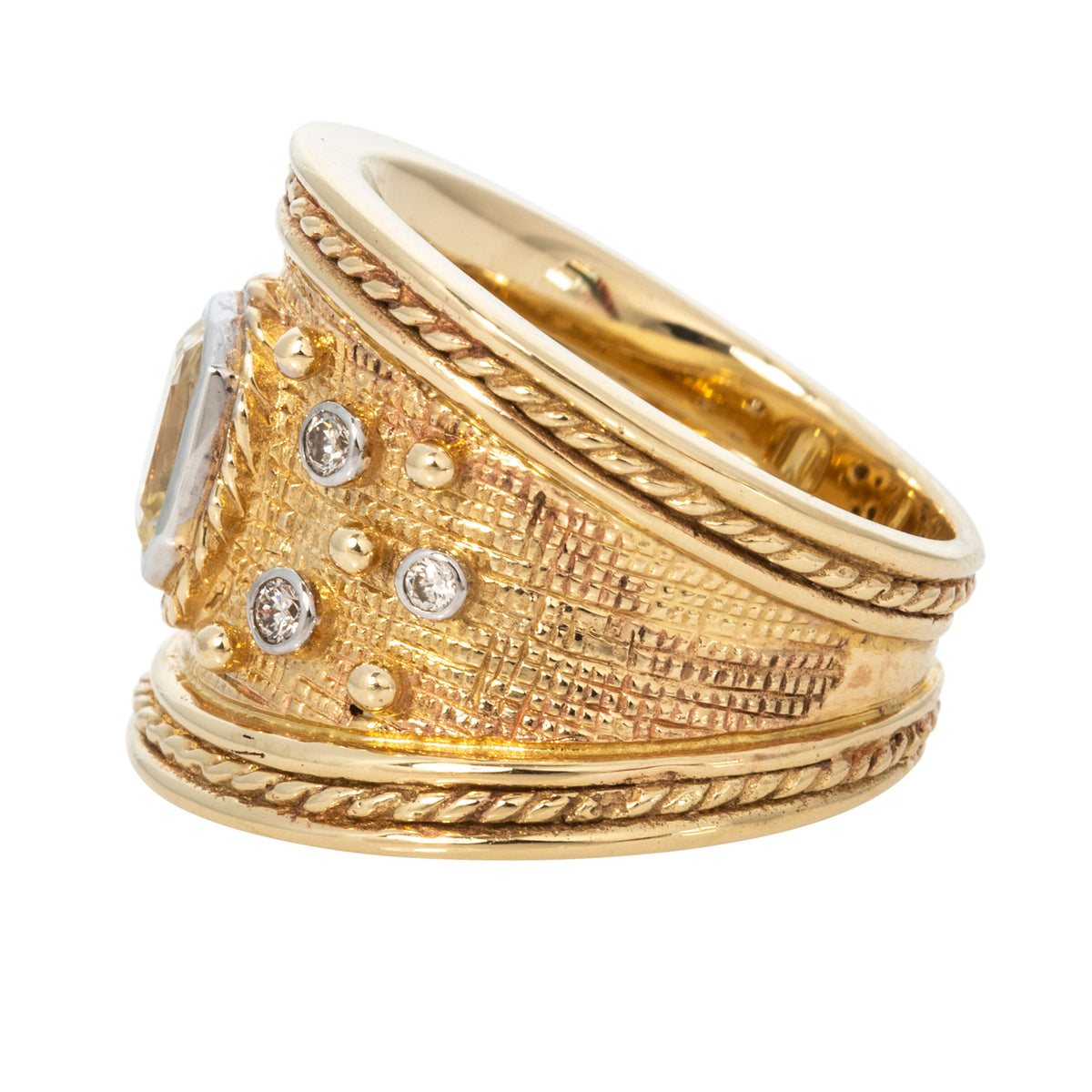 Side view of Byzantine-style diamond ring showing the wide, textured yellow gold band and twisted rope borders.