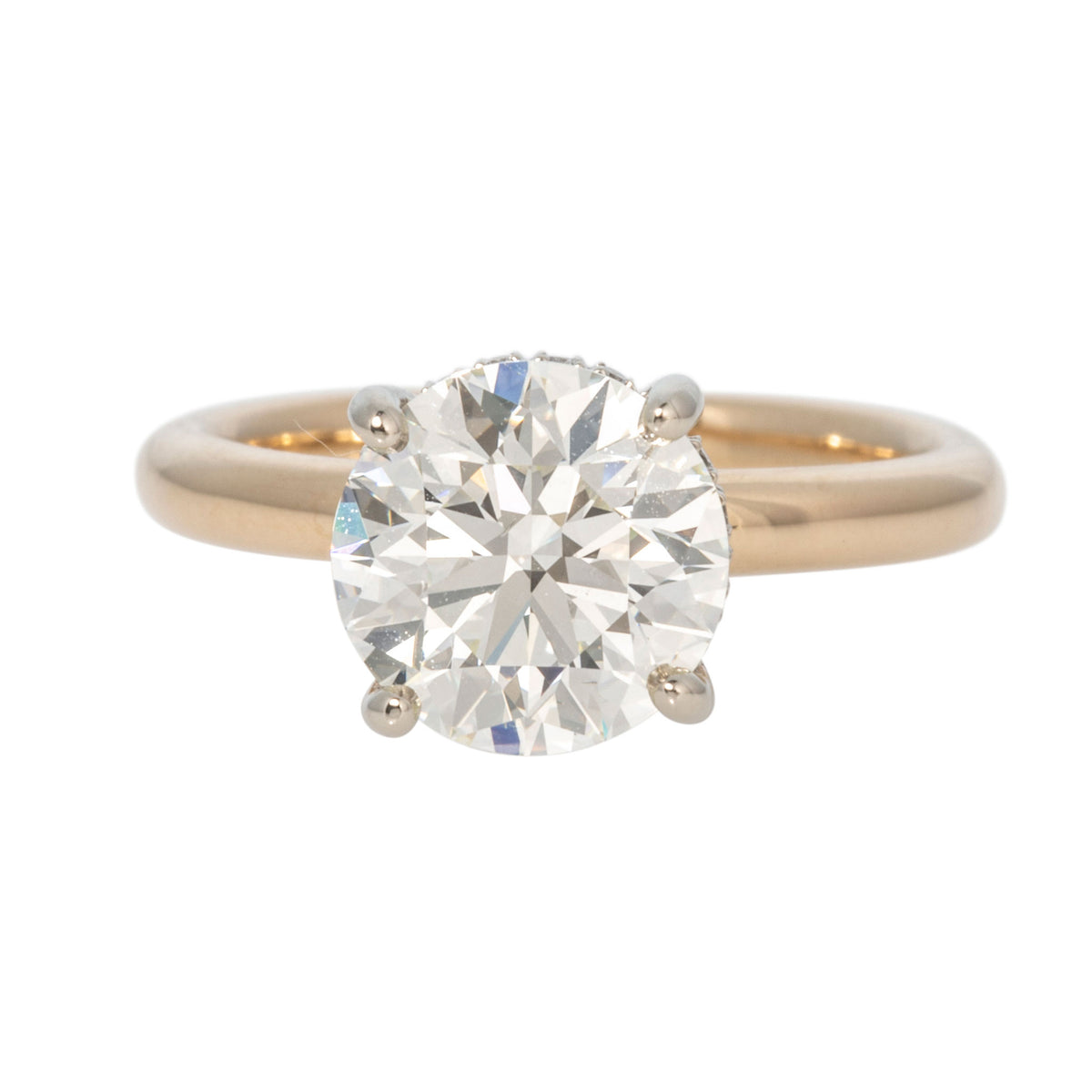 Front view of a 2.58ct round diamond solitaire engagement ring with a four-prong setting and 14K yellow gold band.