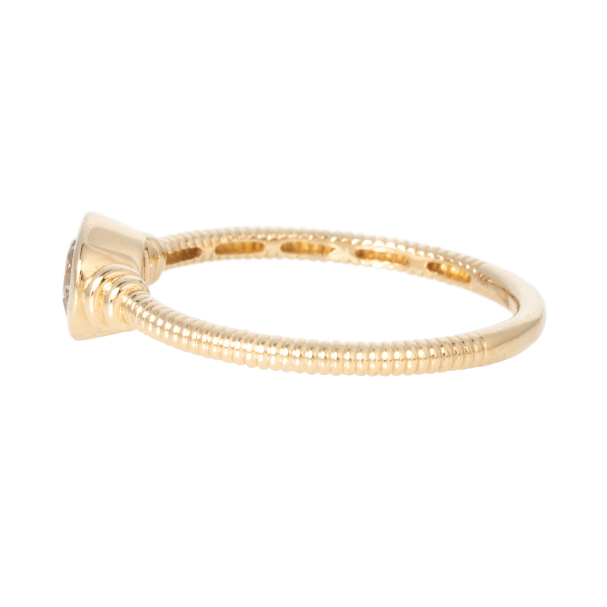 Side view of round diamond solitaire ring showing the bezel setting and ribbed 14K yellow gold band.