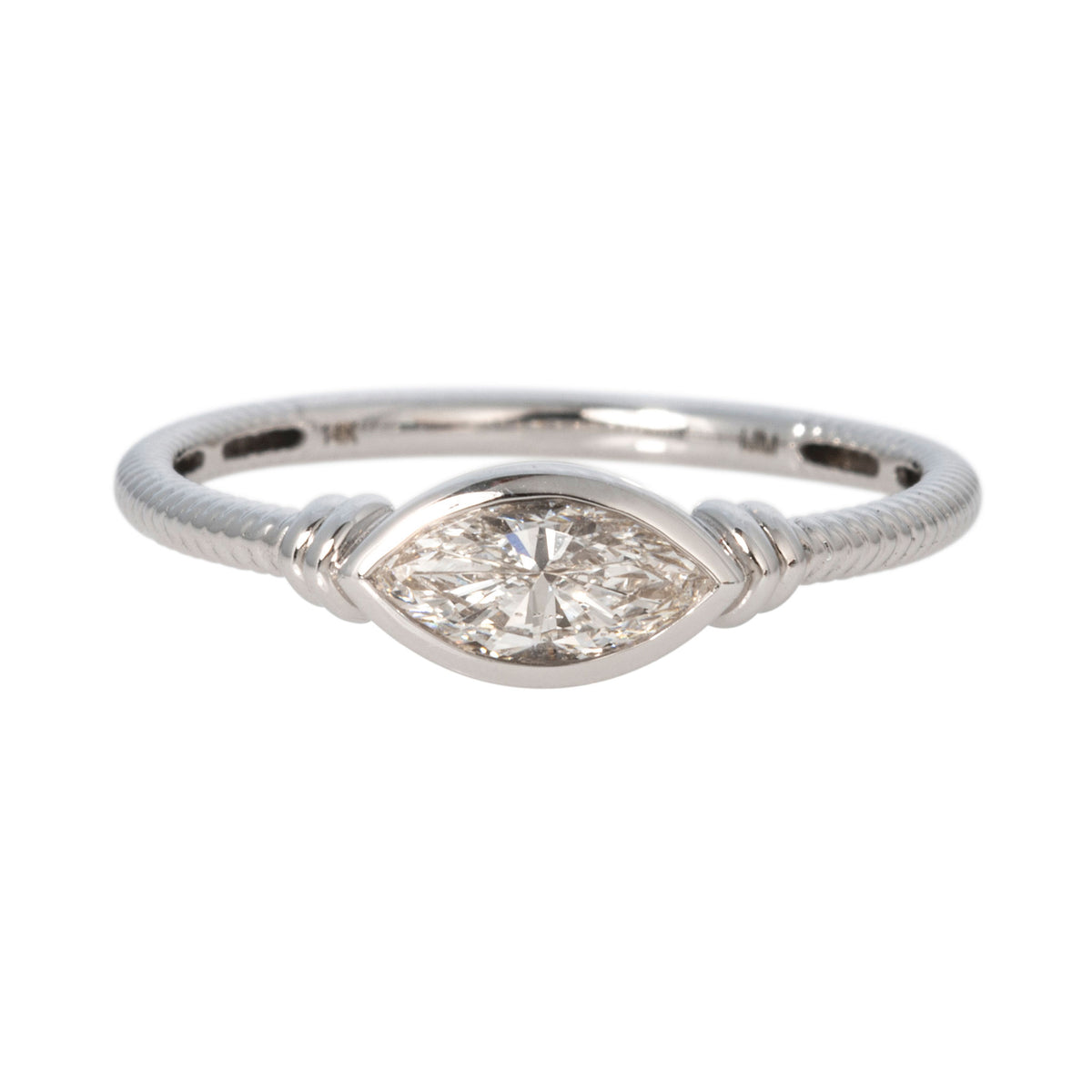 East-west marquise diamond solitaire ring with a bezel setting and ribbed 14K white gold band.