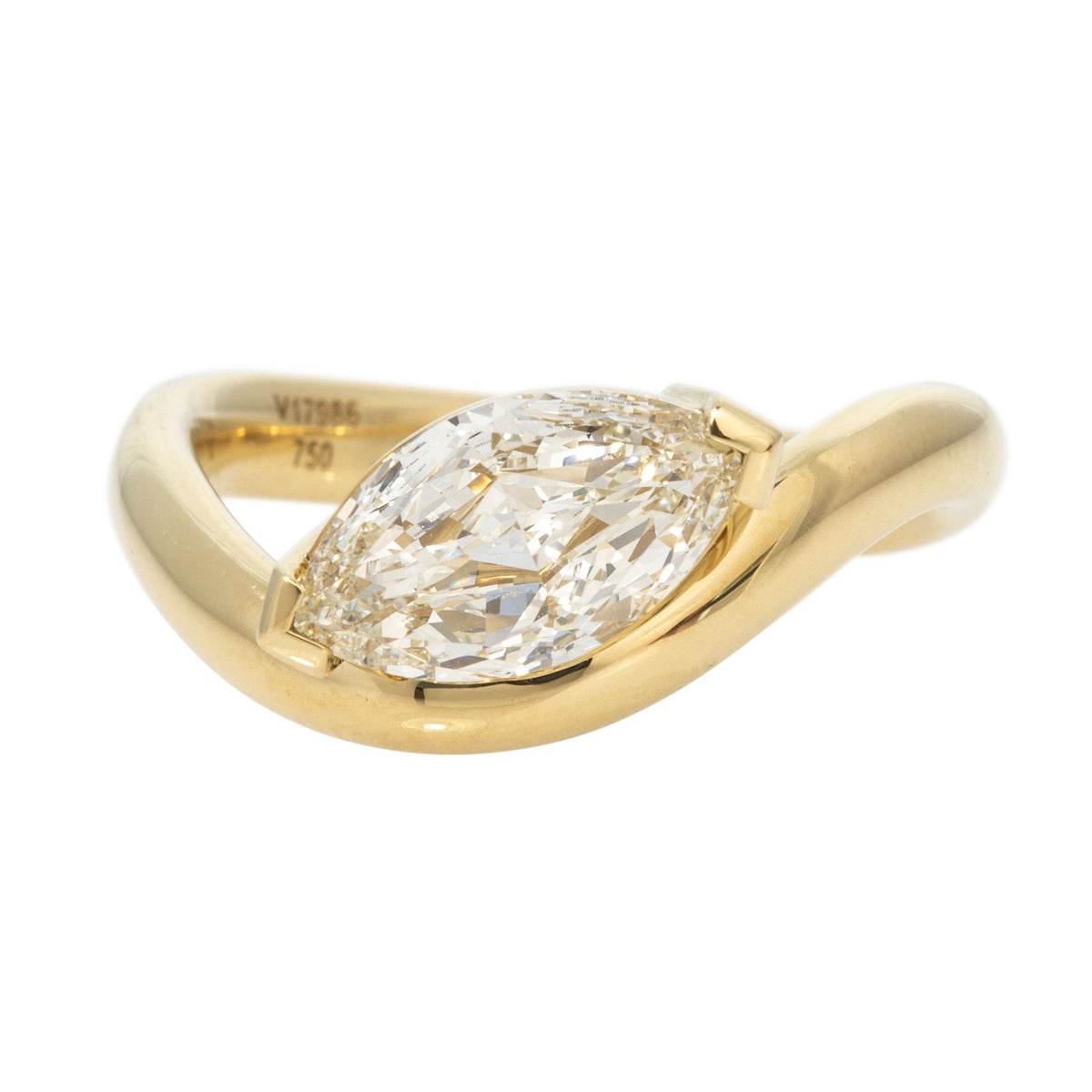 East-west marquise diamond solitaire ring in 18K yellow gold with a curved wave band.