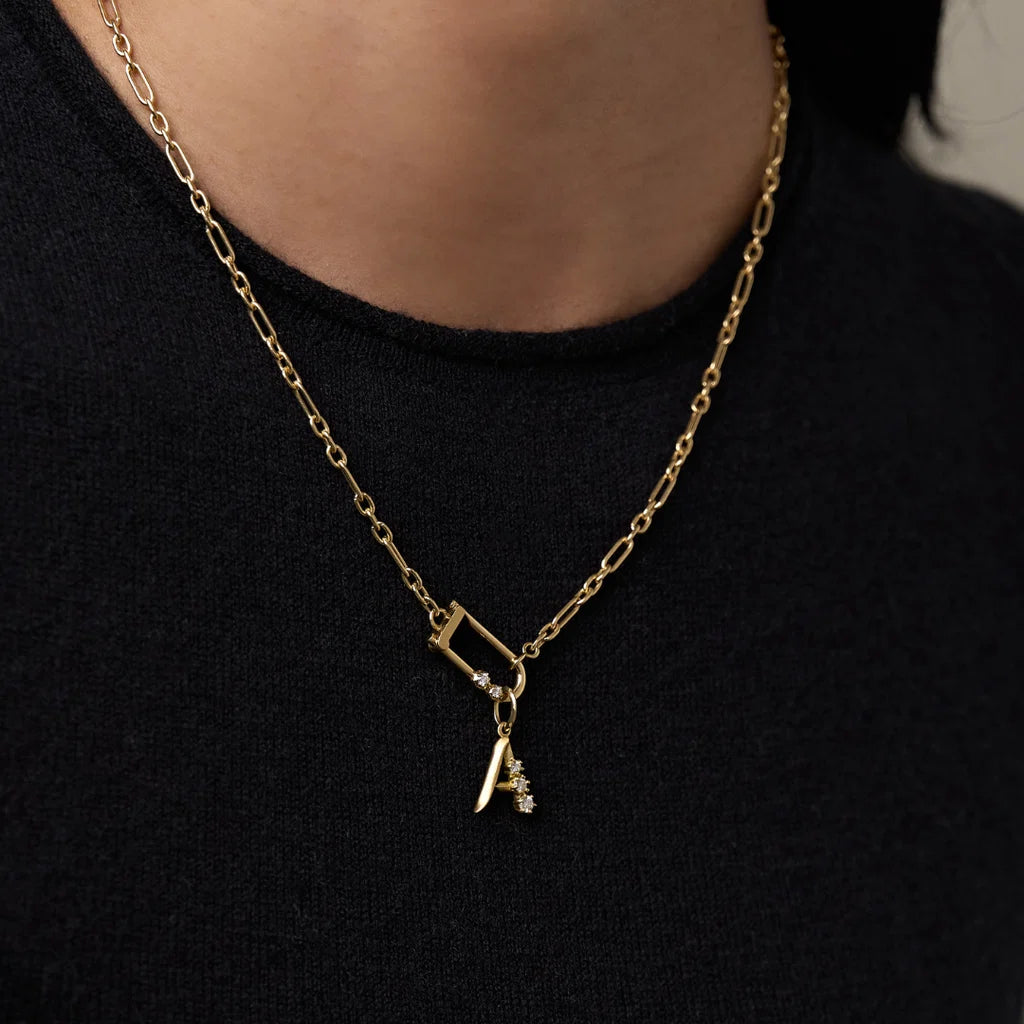 Jade Trau Letter Charm A styled on a chain