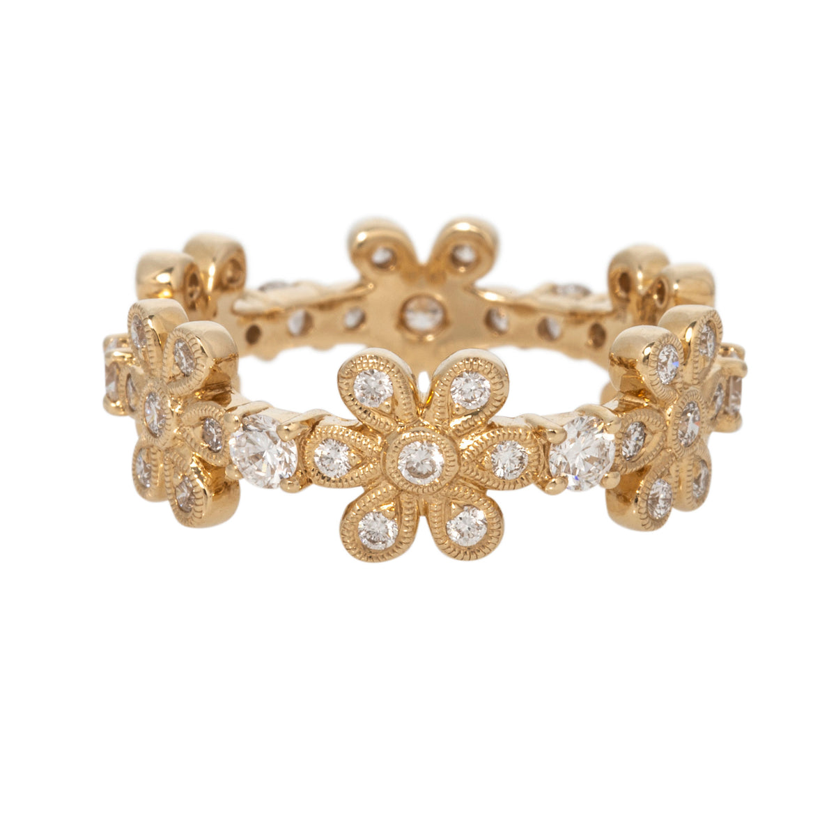 14K yellow gold eternity band with diamond-set flowers, milgrain edges, and round diamonds between each floral motif.