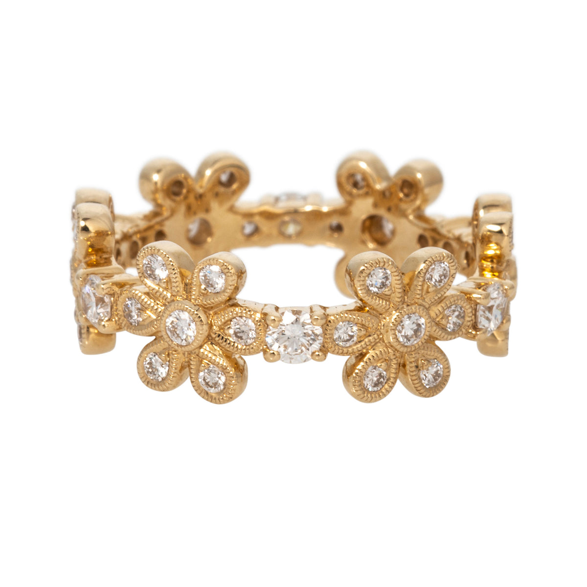 Alternate view of yellow gold floral eternity band showing two diamond-set flowers separated by a prong-set round diamond.