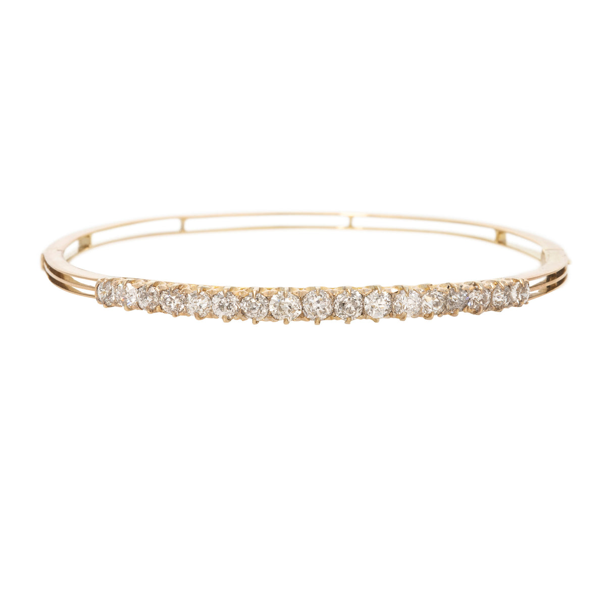 Victorian-style 14K yellow gold bangle with graduated prong-set Old Mine cut diamonds, shown on a white background.