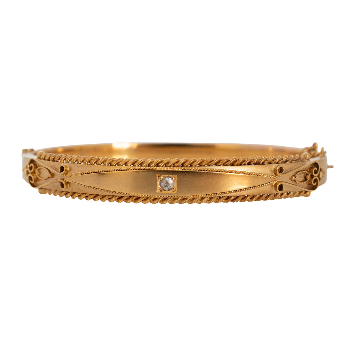 Victorian Etruscan Revival 9K yellow gold bangle with a central diamond, twisted rope borders and scroll wirework.