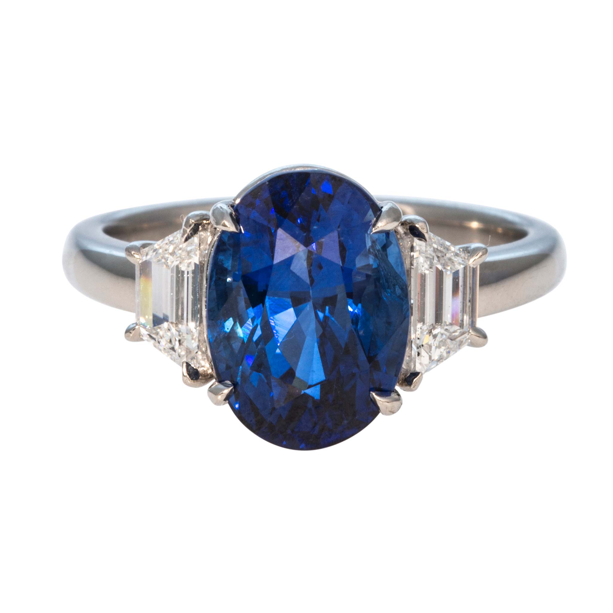 5ct Oval Sapphire & Trapezoid Diamond Three-Stone Platinum Ring