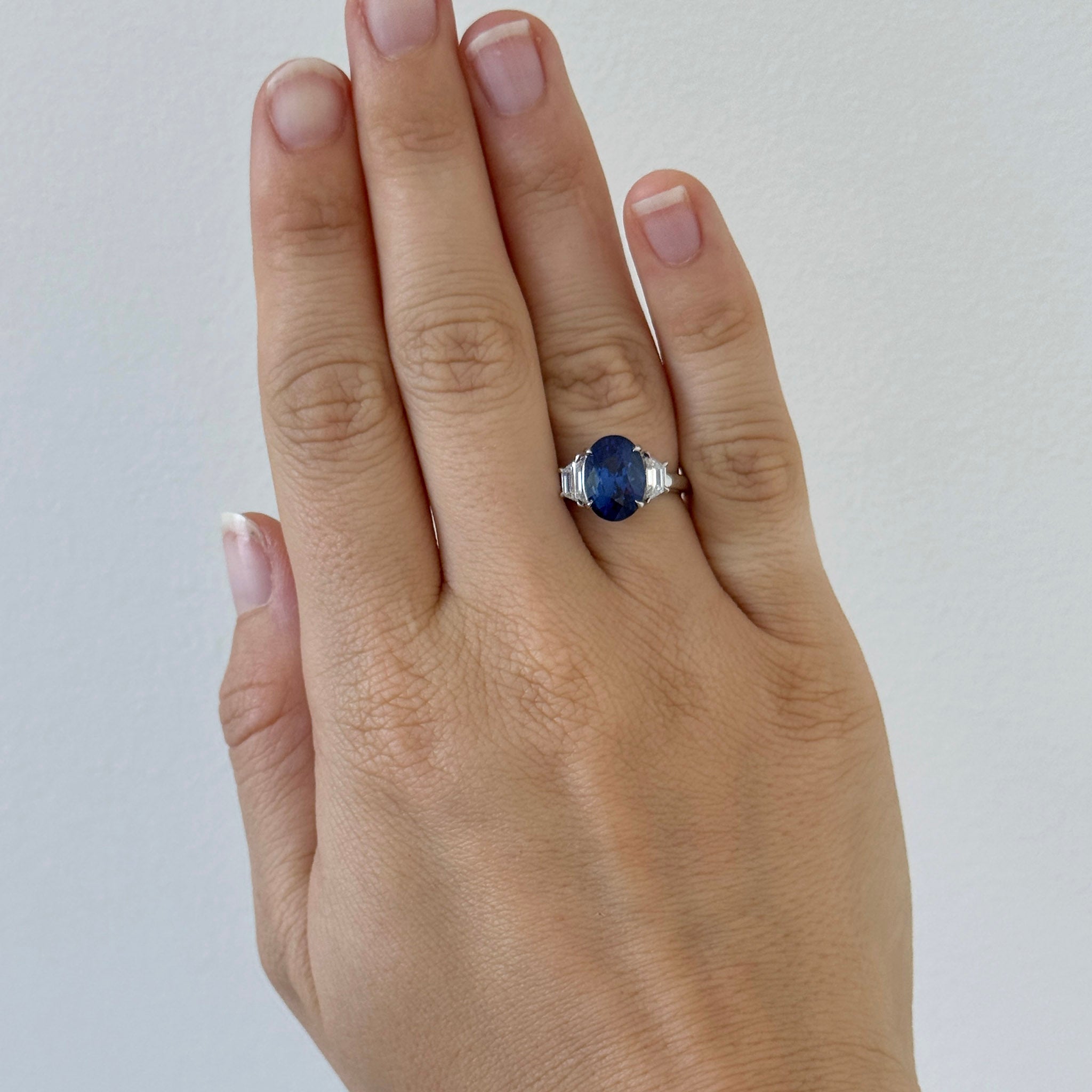 5ct Oval Sapphire & Trapezoid Diamond Three-Stone Platinum Ring