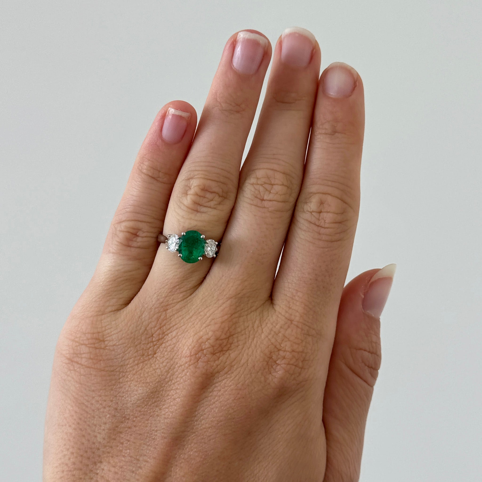1.76ct Oval Emerald & Diamond Three-Stone Platinum Ring