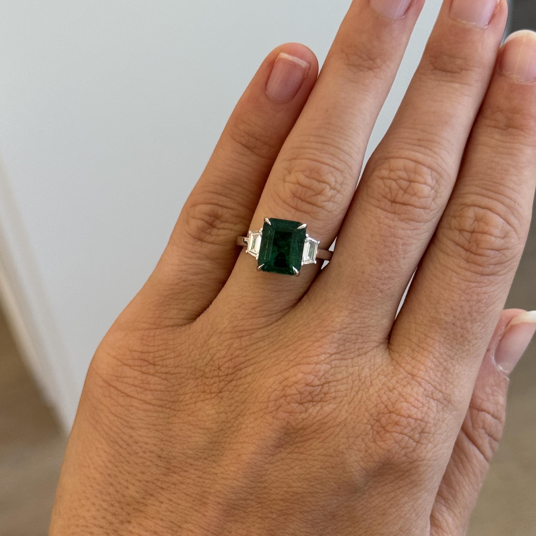 4.56ct Emerald & Trapezoid Diamond Three-Stone Platinum Ring
