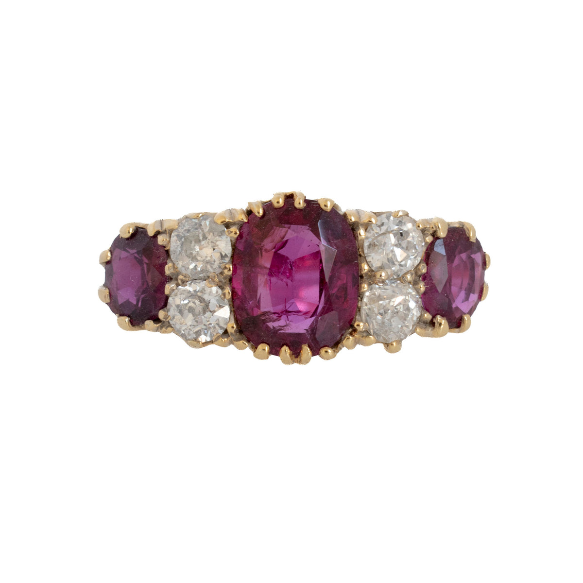 Victorian-style 18K yellow gold ring with three cushion-cut rubies and four Old Mine cut diamonds.
