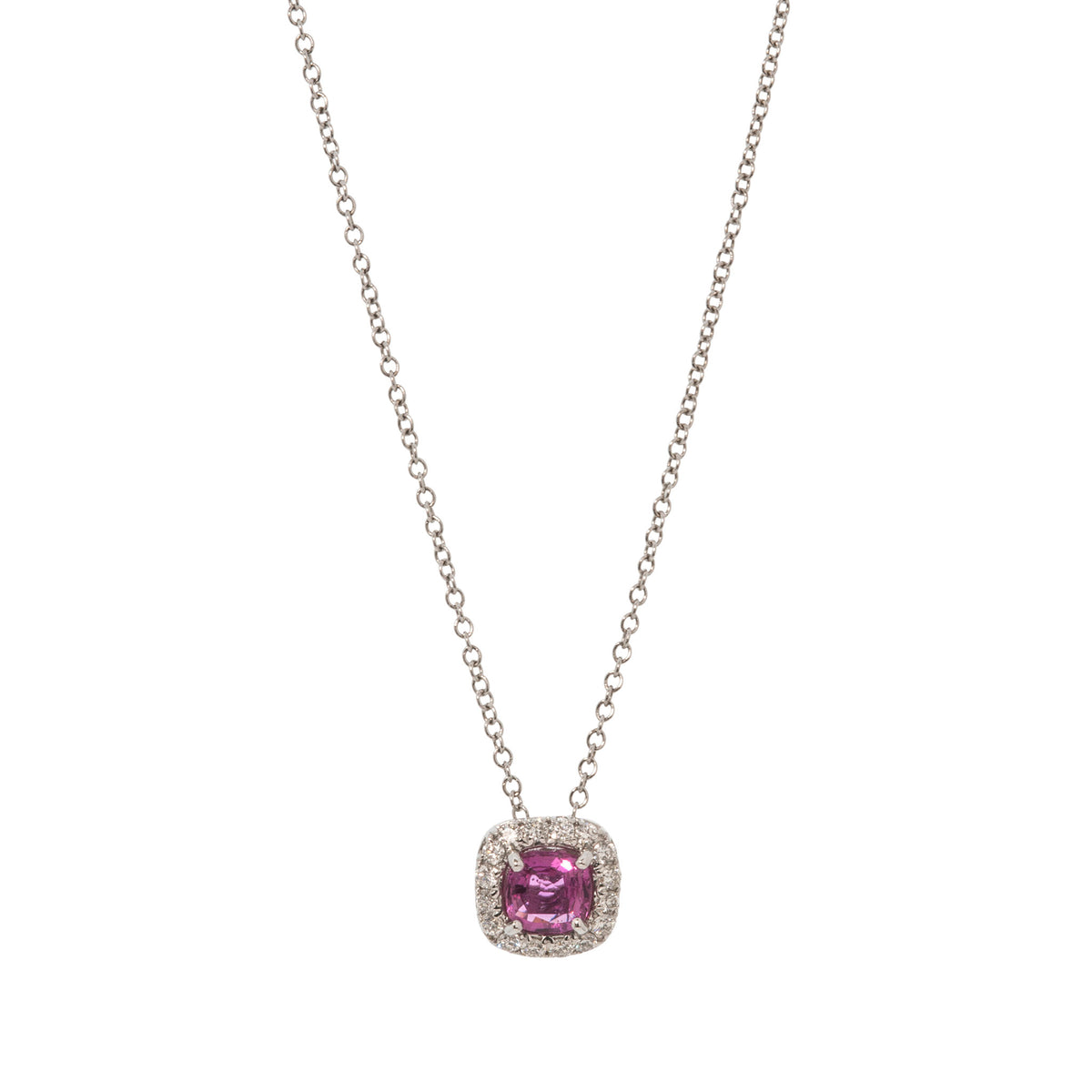 Cushion-shaped pink sapphire pendant with a round diamond halo on an 18K white gold cable chain, shown on a white background.