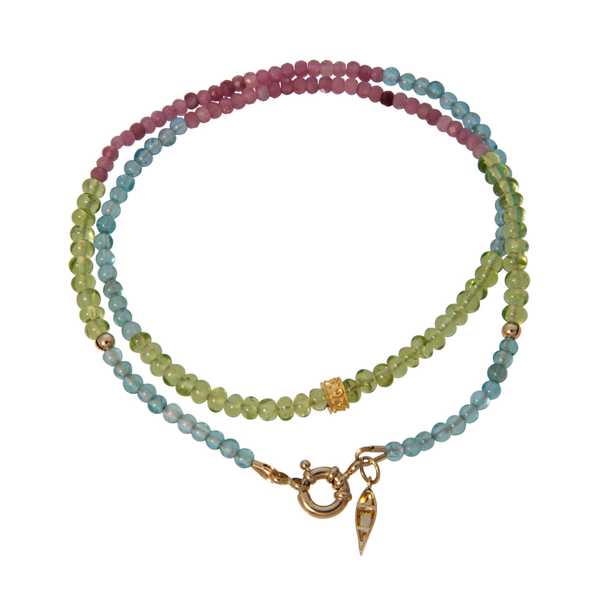 Tippy Stern Rainbow Row necklace with green, light blue, and pink gemstone beads, an ornate yellow gold rondelle, and a canoe charm.