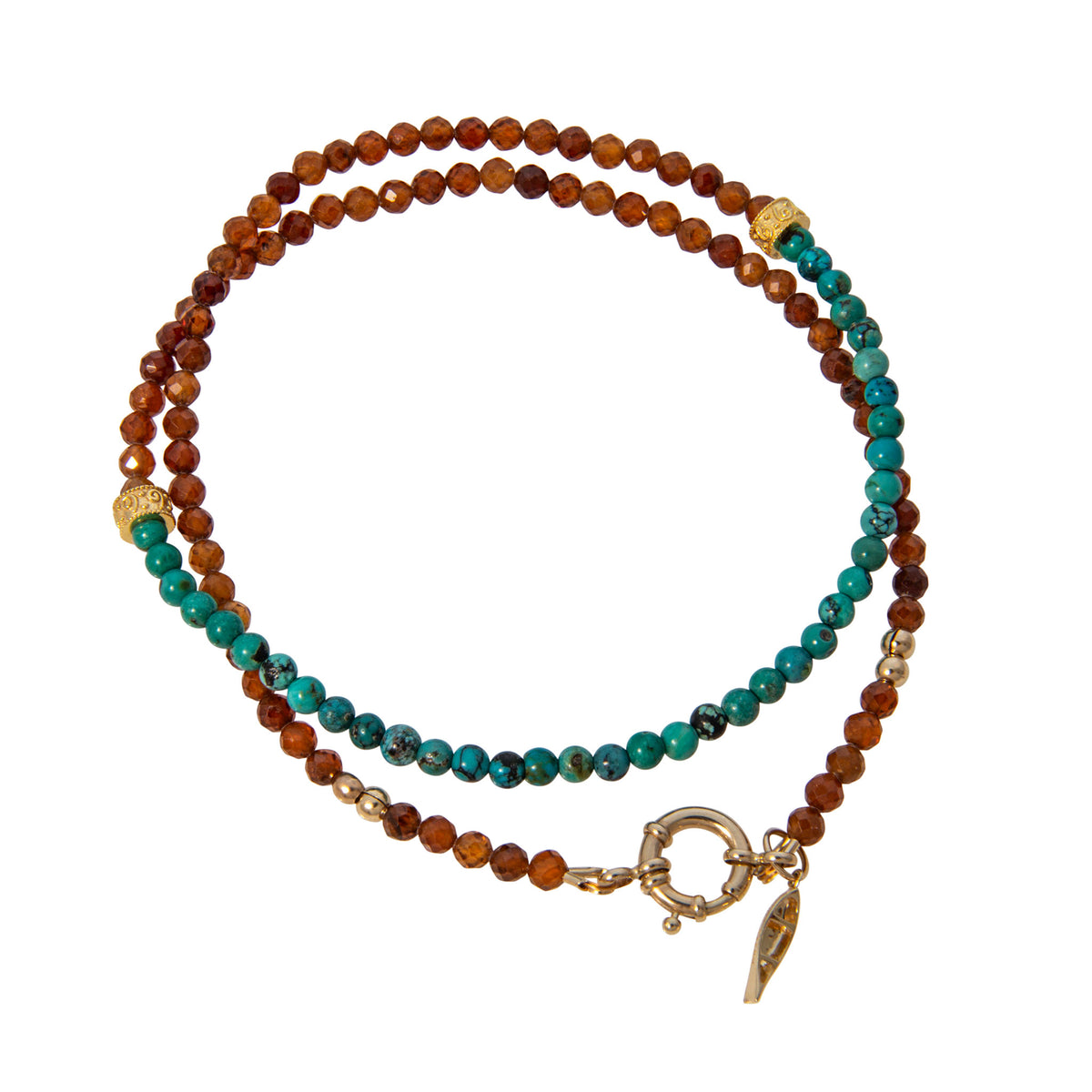Tippy Stern turquoise and faceted hessonite garnet beaded necklace with two ornate yellow gold rondelles and a canoe charm.