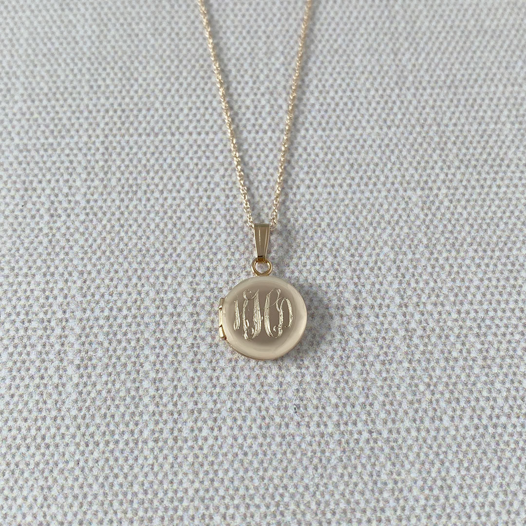 Baby 14K Yellow Gold Round Locket Necklace with machine engraved interlocking script monogram