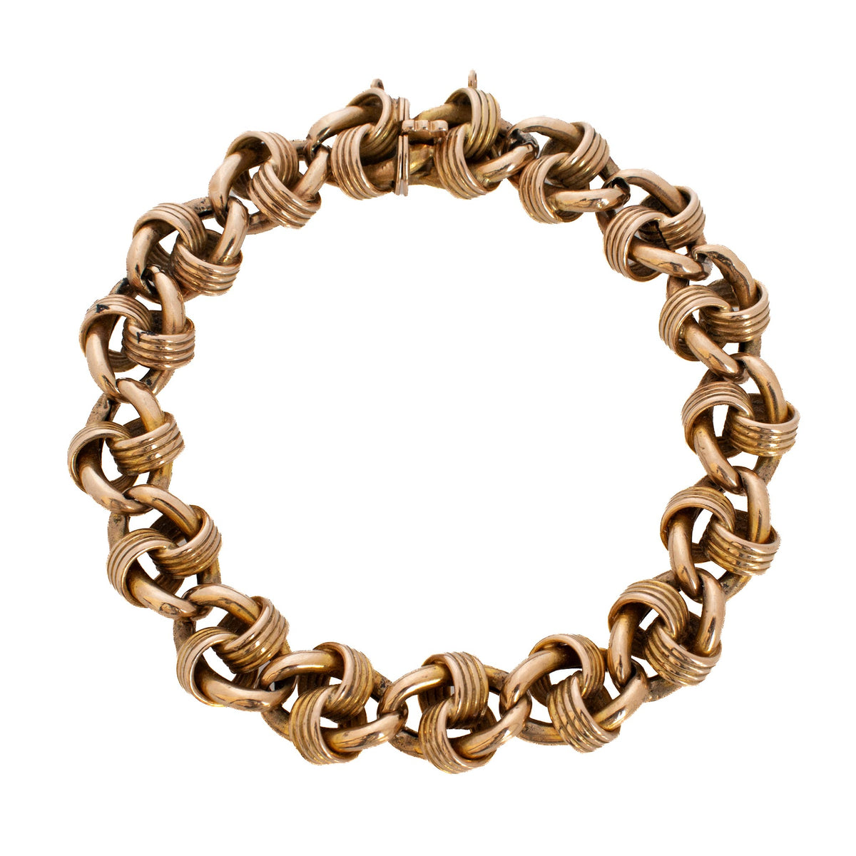 Victorian 15K yellow gold fancy link bracelet with interlocking polished and ribbed links arranged in a circle.