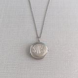 Sterling Silver 23mm Engraved Round 4 Photo Locket Necklace with machine engraved interlocking script monogram