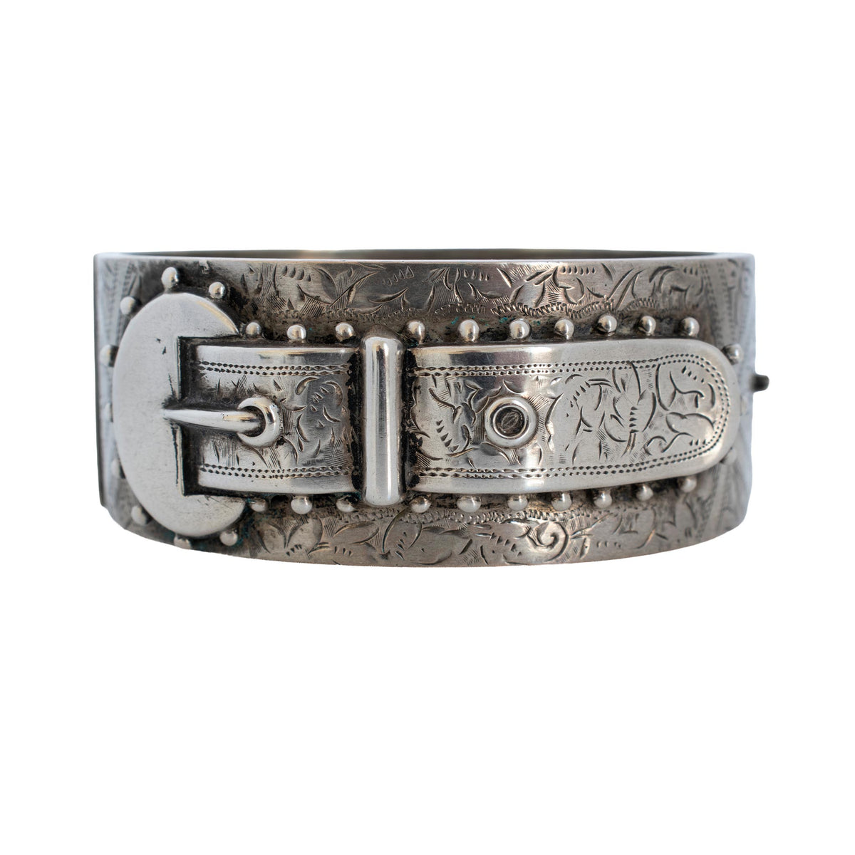 Victorian sterling silver buckle bangle with engraved floral detailing and beaded accents.