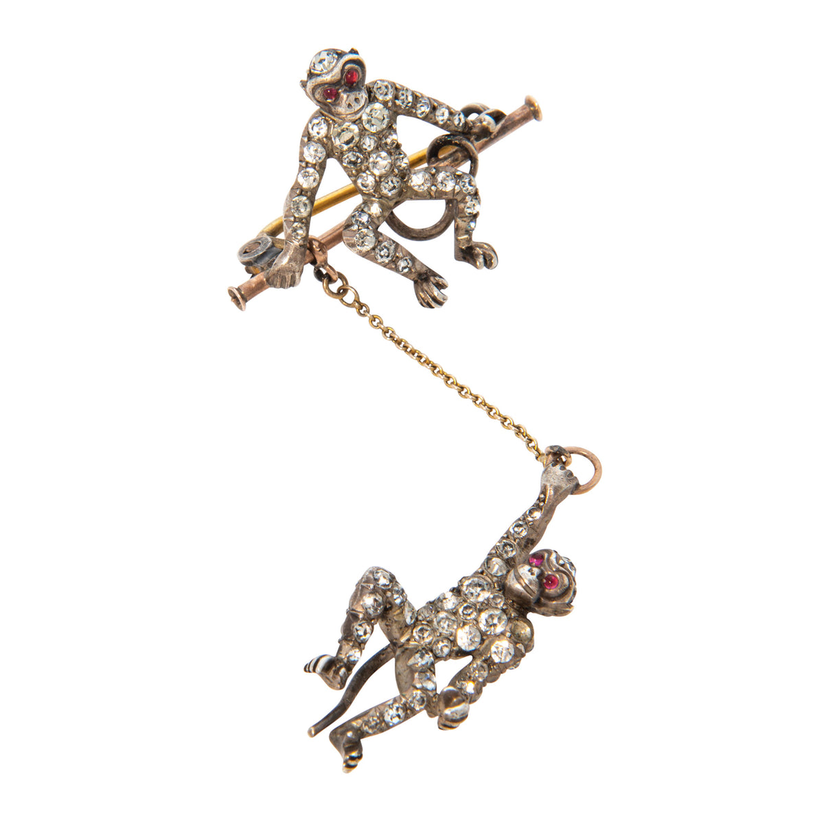 Vintage paste stone monkey brooch with one monkey seated on a bar and another dangling from a gold chain.