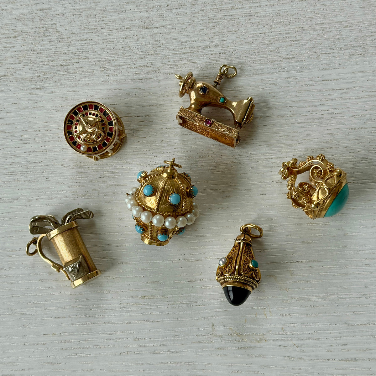 Vintage Enamel Roulette Wheel Dice Cage 14K Gold Charm, Vintage 14K Gold Multi-Stone Sewing Machine Charm, Vintage Etruscan-Revival Multi-Stone 18K Gold Fob Pendant, Vintage Etruscan-Revival Turquoise 18K Gold Fob Pendant