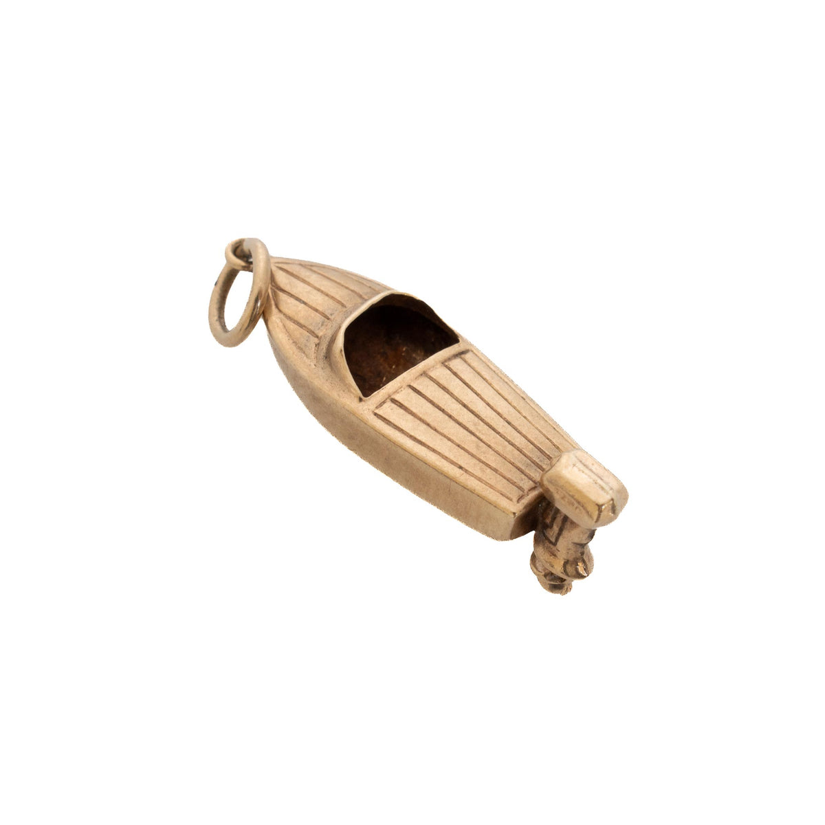 Vintage 9K yellow gold speedboat charm shown at an angle, with a grooved deck, open cockpit, and outboard motor.