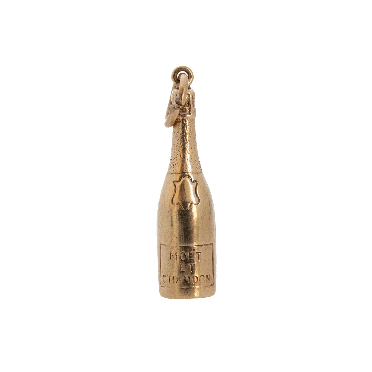 Vintage 9K yellow gold champagne bottle charm with an engraved Moët & Chandon label on a white background.