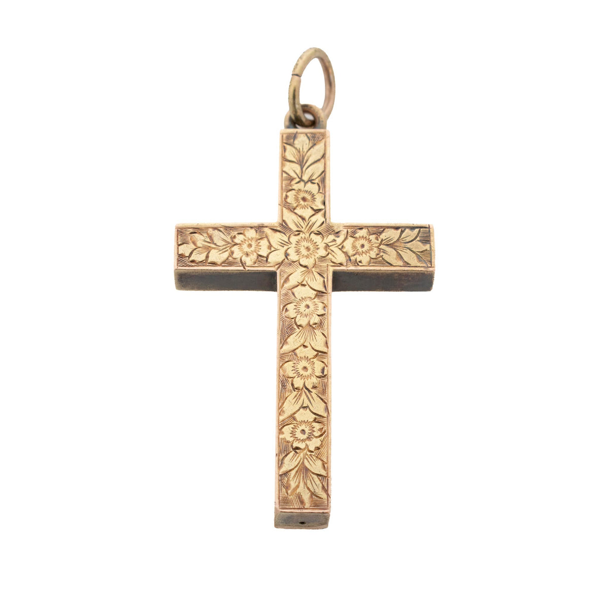 Victorian 15K yellow gold cross pendant with hand-engraved flowers and leaves on a white background.