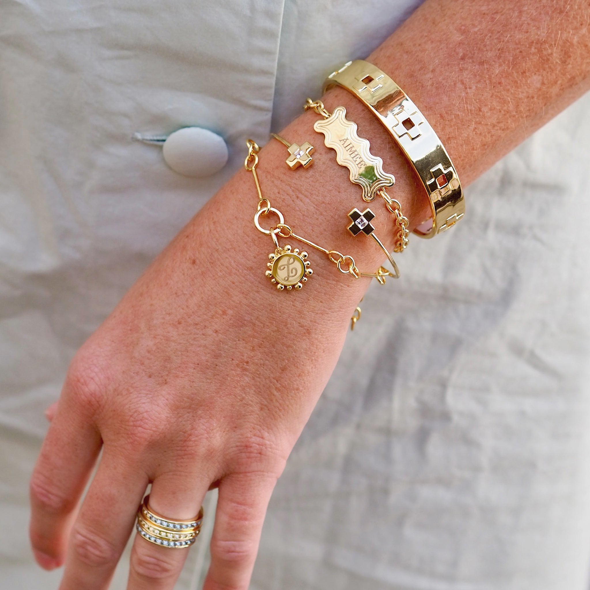 Goldbug Collection Wide Cross Bangle, Wavy ID Bracelet, White Topaz Cross Bangle, Petite Wishbone Bracelet, Twiggy Charm