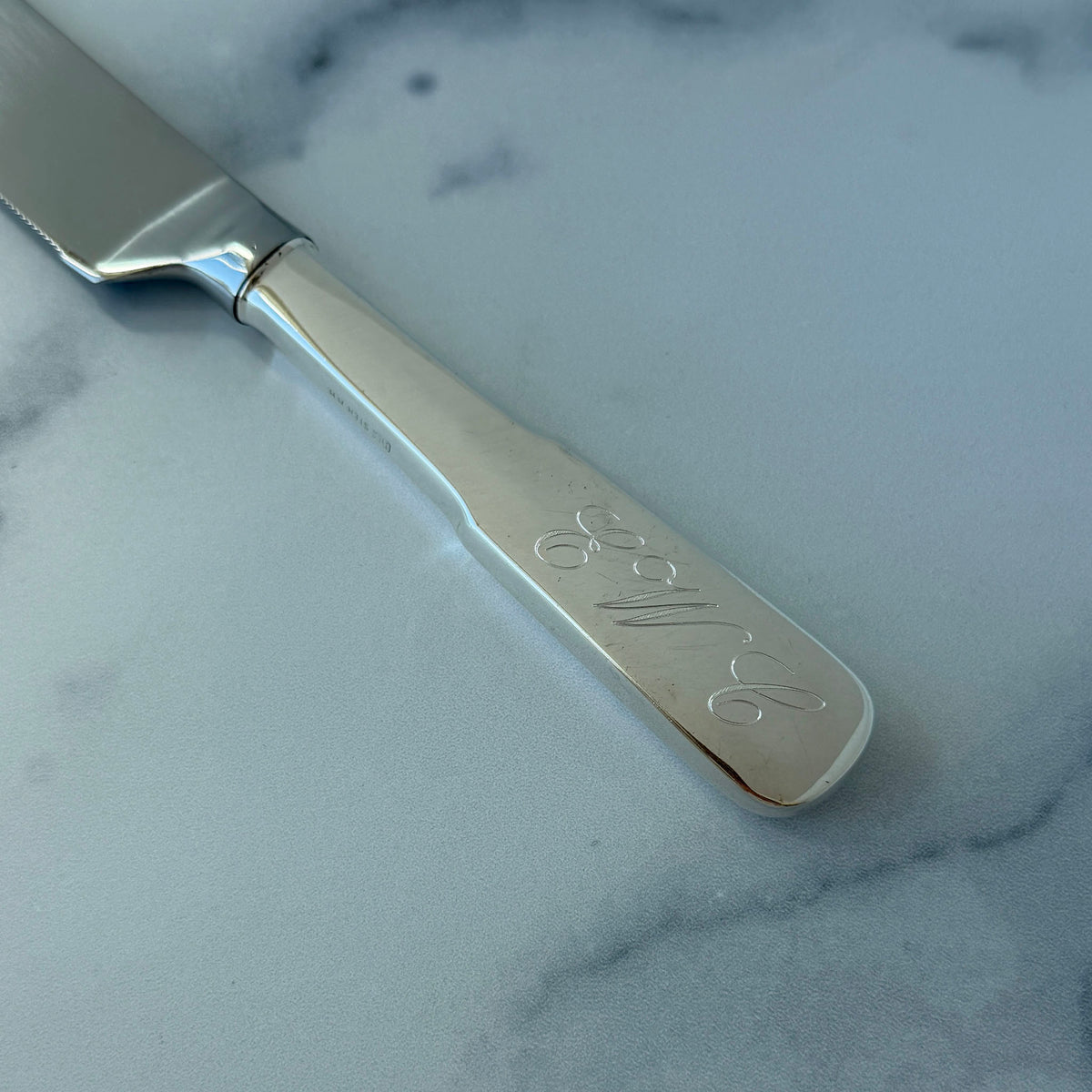 Eighteen Ten International Sterling Silver Wedding Cake Knife with machine engraved handle